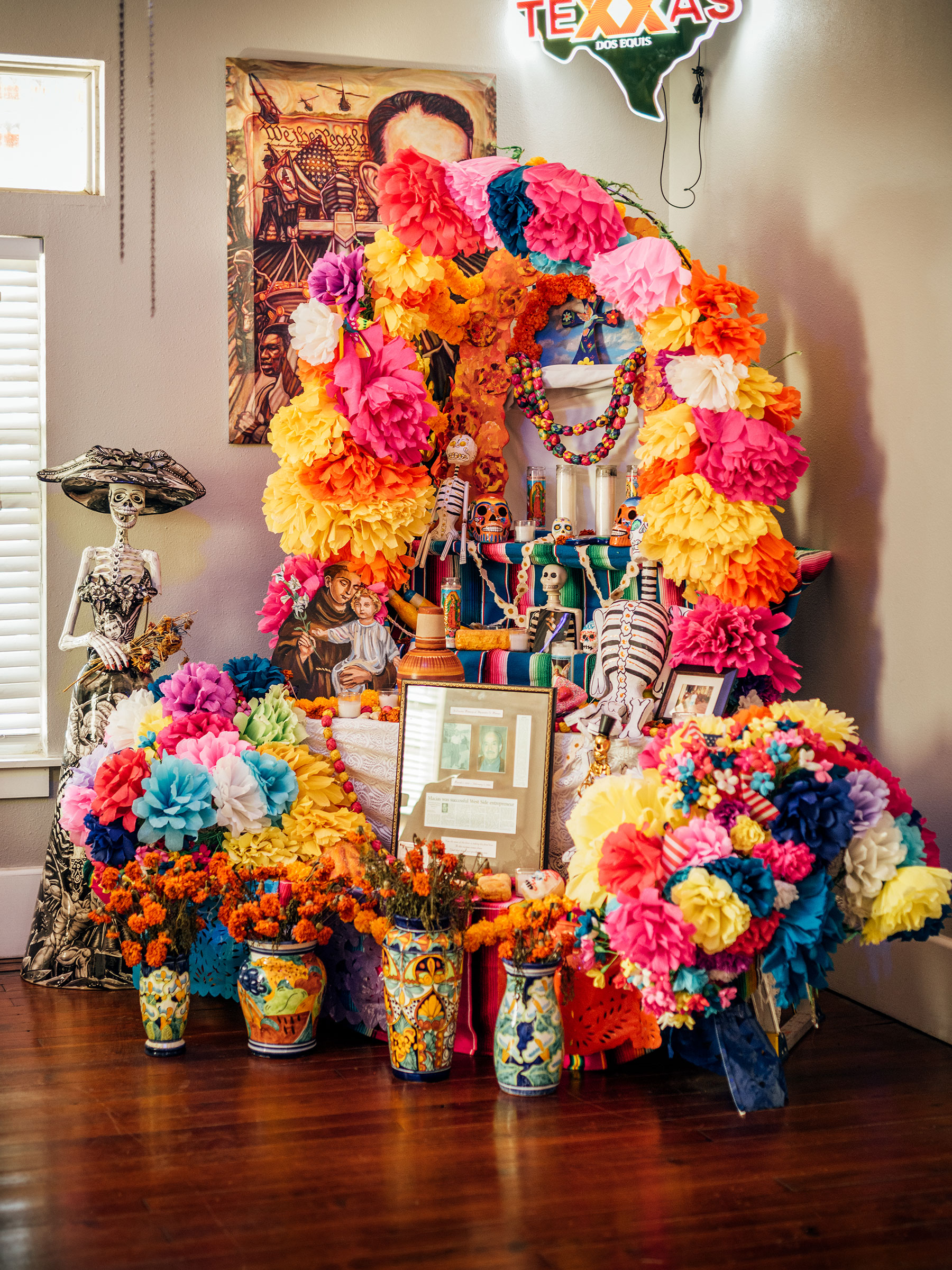 Jaime Macias created an alter inside his business, Jaime's Place, for community members to bring "ofrendas" or offerings for Dia de los Muertos, or Day of the Dead