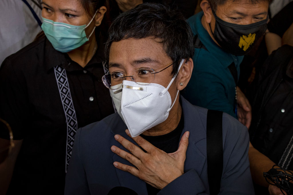 Maria Ressa, editor and CEO of Rappler, speaks to reporters after being convicted for cyber libel at a regional trial court on June 15, 2020 in Manila, Philippines. (Ezra Acayan—Getty Images)