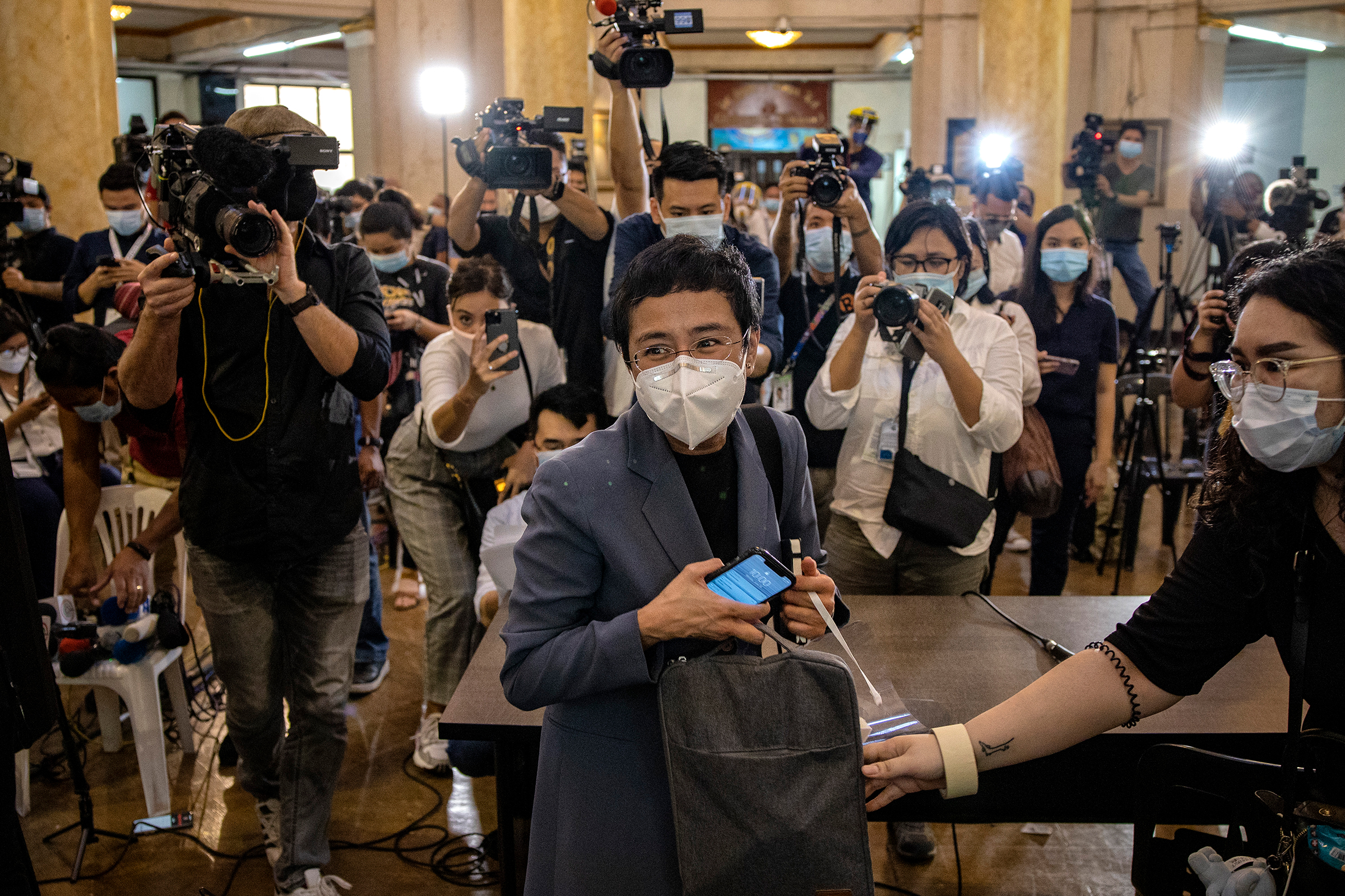 Maria Ressa, editor and CEO of Rappler, leaves a regional trial court after being convicted for cyber libel, in Manila on June 15, 2020. Ressa and Dmitry Muratov of Russia were awarded the 2021 Nobel Peace Prize on Oct. 8. (Ezra Acayan—Getty Images)