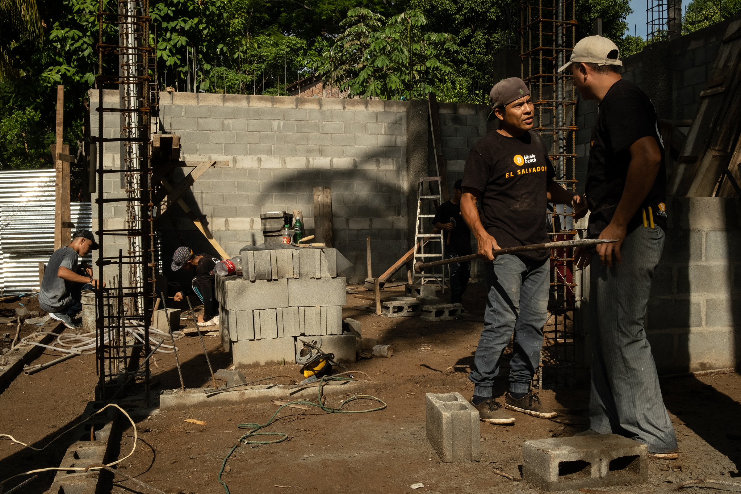 Construction workers, who are paid in bitcoin, work on a building outside the "bitcoin beach" office in El Zonte, El Salvador, on June 14, 2021. (Cristina Baussan—Bloomberg/Getty Images)