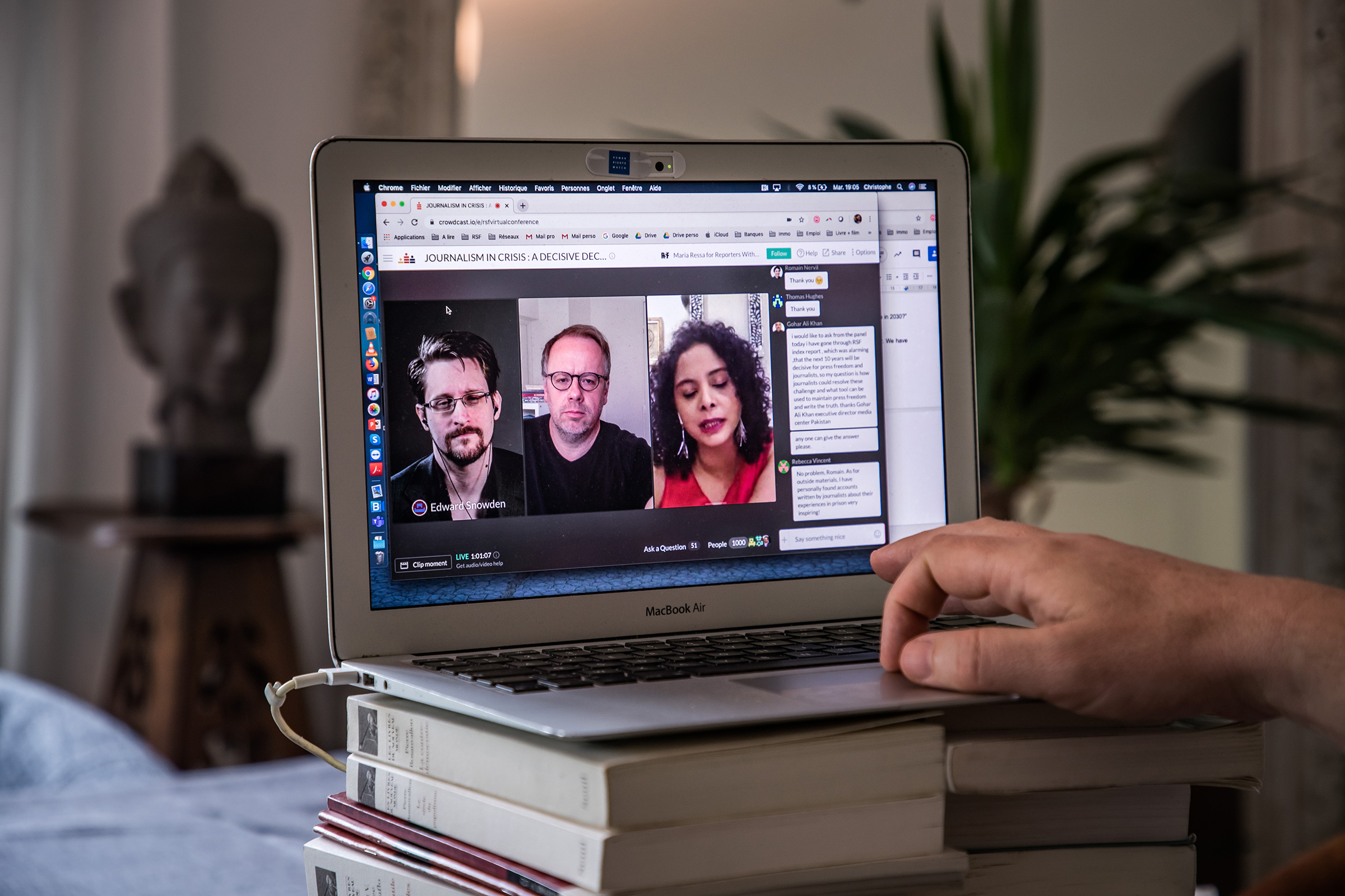 Christophe Deloire (R), Secretary General of Reporter Without Borders, attends a video conference call with Edward Snowden (L on the screen) and Rana Ayyub (R on the screen) during the launch of the 2020 Press Freedom Index in Paris in April 2020.