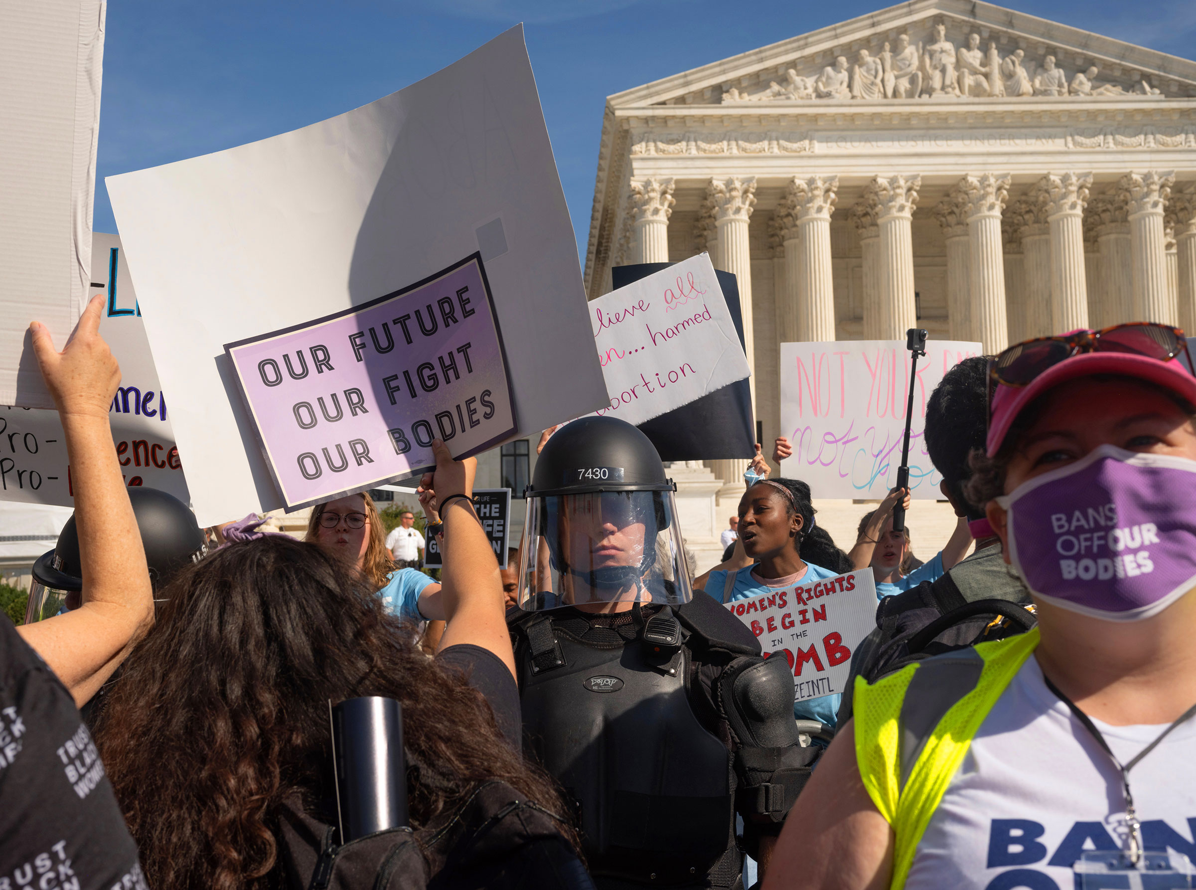 Protesters and counter-protestors meet outside of the Supreme Court at the Women's March and Rally for Abortion Justice in Washington, on Oct. 2, 2021. (Elizabeth Bick for TIME)
