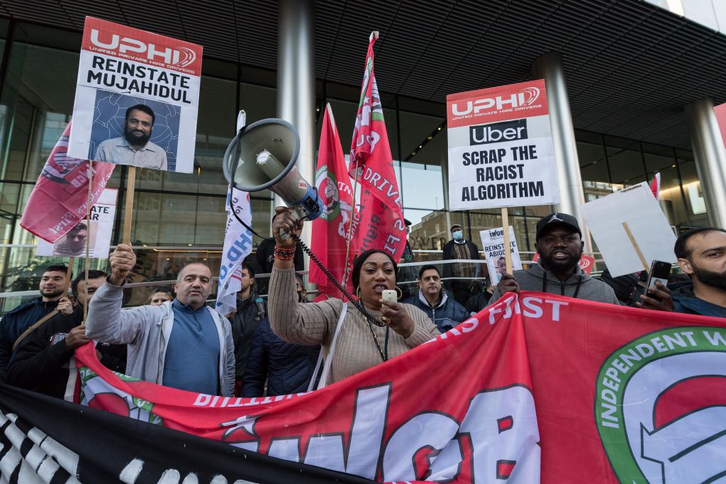 Uber drivers stage a protest outside the company's London HQ during a 24-hour strike action demanding better rates per mile with no fixed rate trips, reduction in Uber's commission to 15%, an end to the use of allegedly 