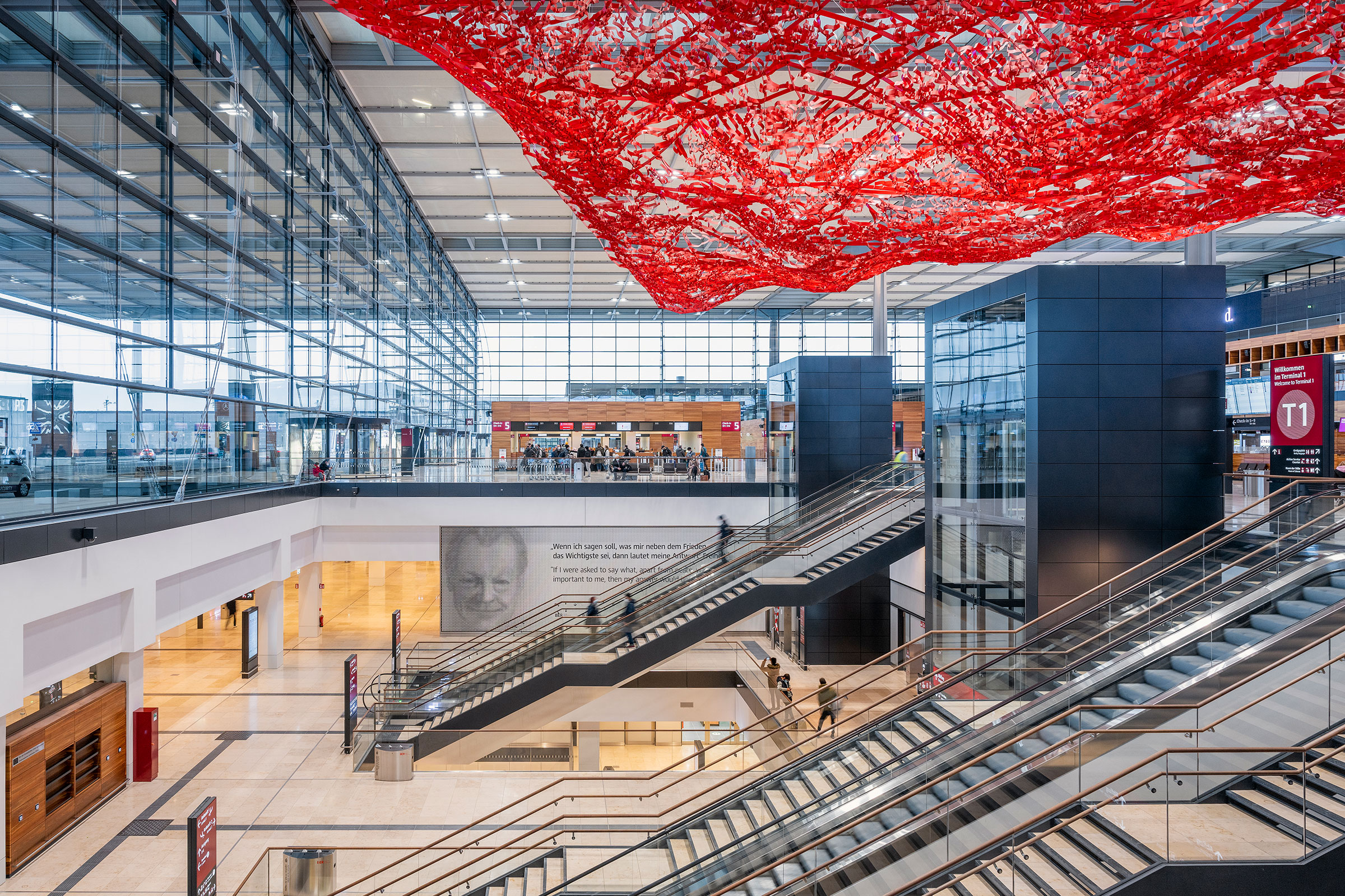 Terminal 1 at the Berlin Brandenburg Airport, where artist Pae White's “The Magic Carpet” hangs on the ceiling. (Courtesy Günter Wicker—Flughafen Berlin Brandenburg GmbH)