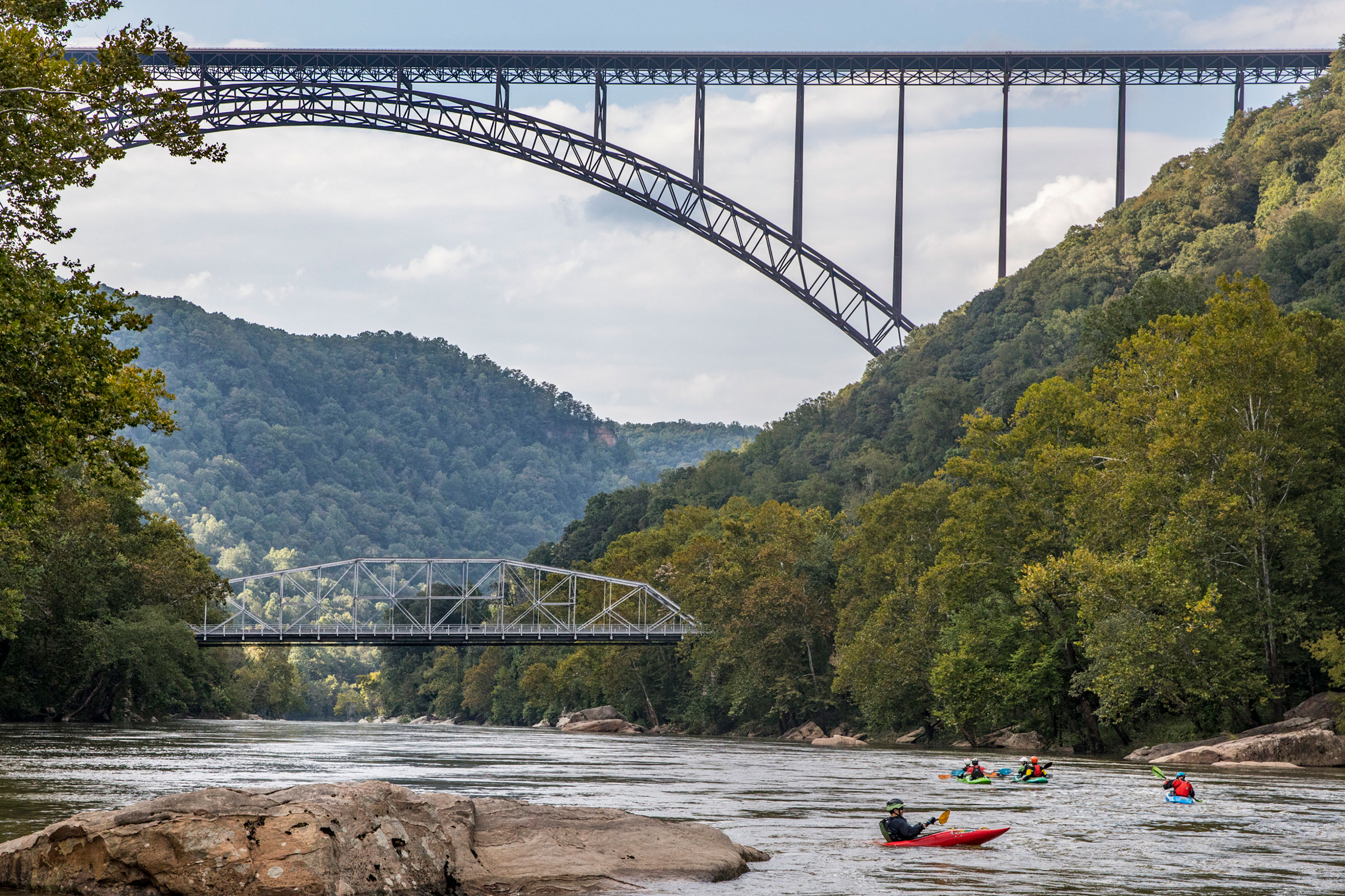 Kayakers under the New River Gorge Bridge in Fayetteville, West Virginia. (Tony Cenicola—The New York Times/Redux)