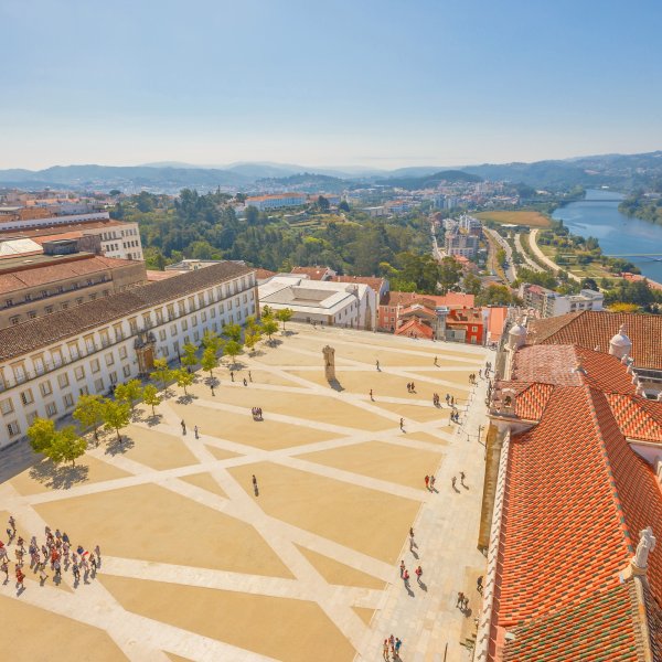 A view of the Coimbra University courtyard, with the Mondego river in the background.
