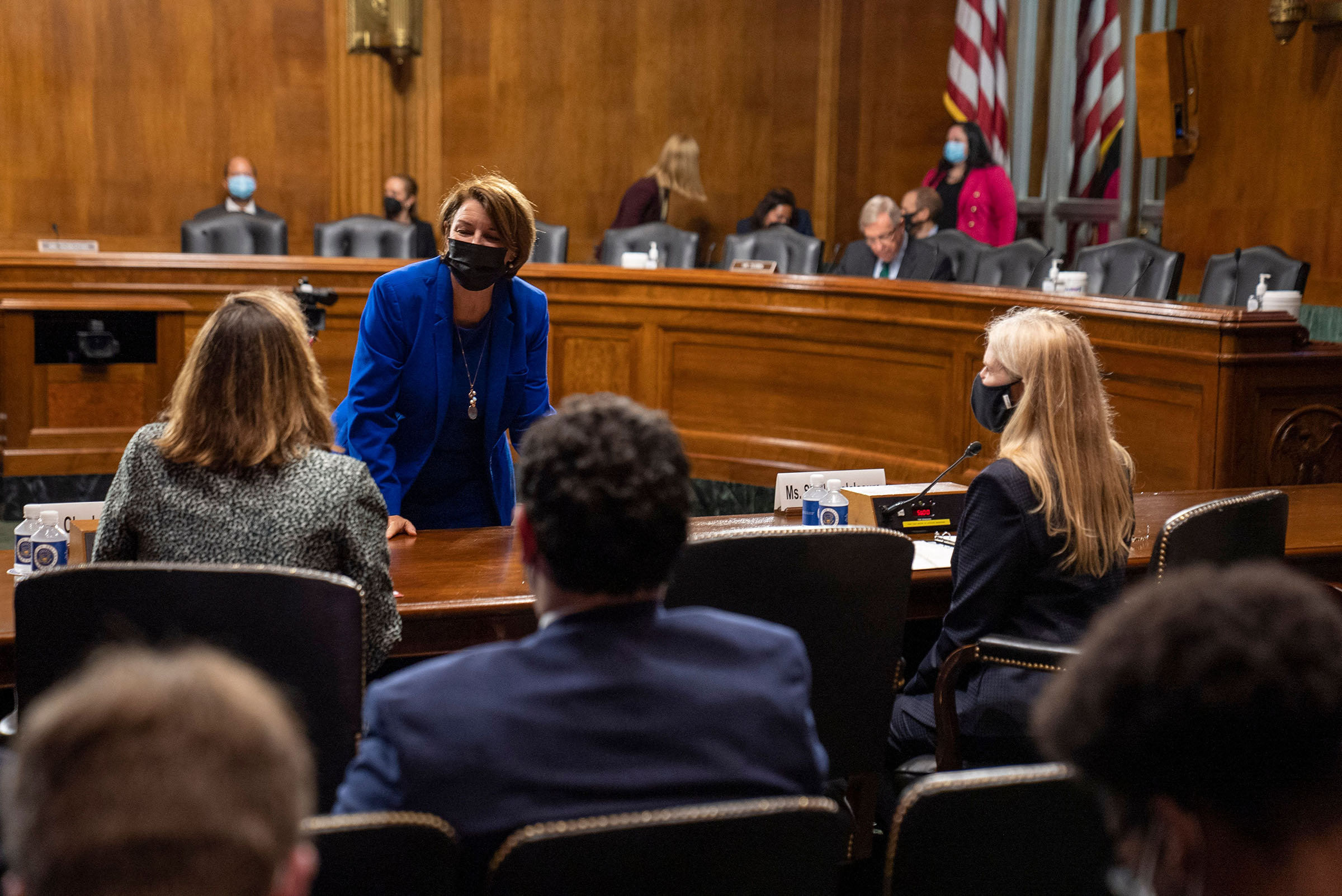 Sen. Amy Klobuchar greets Charlotte Slaiman, Competition Policy director at Public Knowledge, before a hearing of the Judiciary Subcommittee on Competition Policy, Antitrust, and Consumer Rights in Washington, D.C., on Sept. 21, 2021. (Ken Cedeno/AFP/Getty Images)