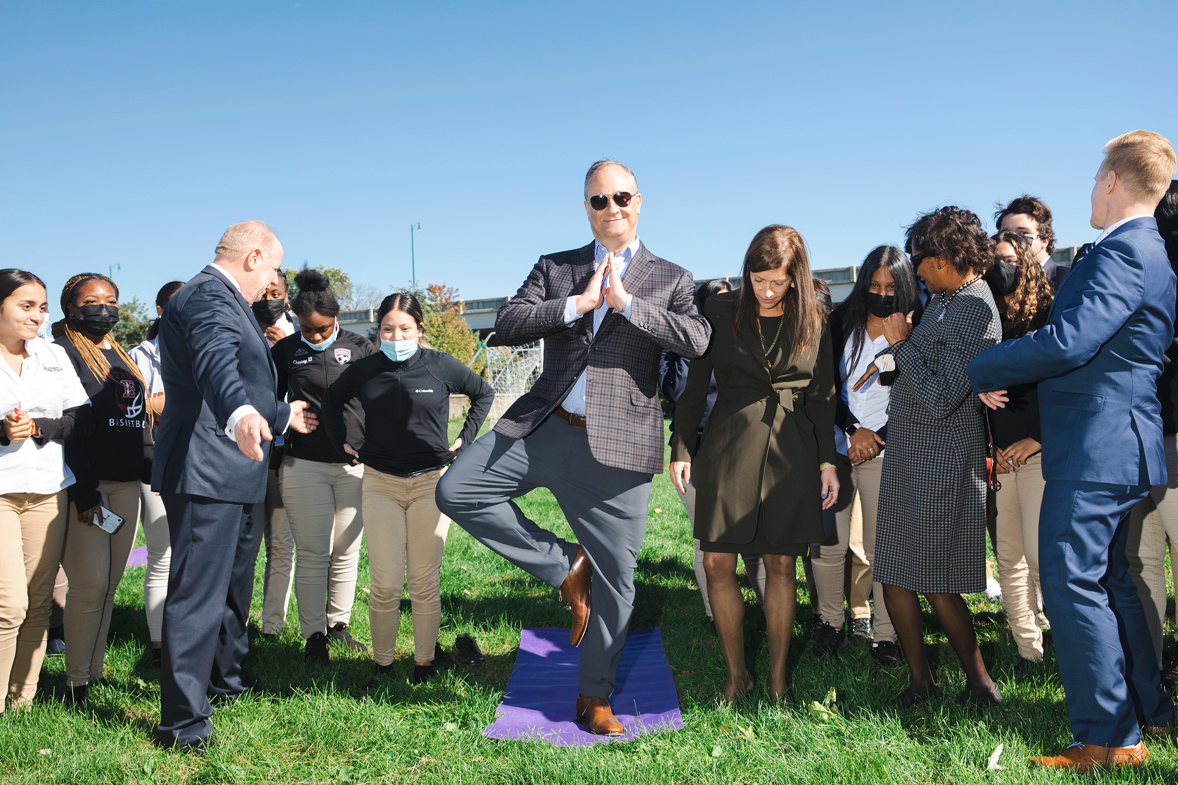 Emhoff practices his tree pose with a yoga class during a visit to New Jersey on Oct. 19, 2021. (Landon Nordeman for TIME)