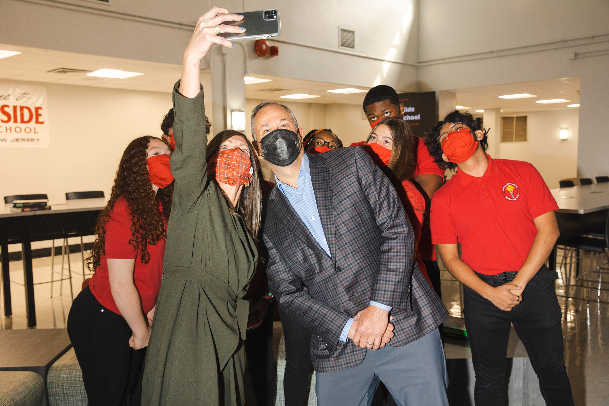 OCT 19 - NEWARK, NJ: Scenes from East Side High School with First Gentleman Doug Emhoff, including the first lady of New Jersey, Tammy Murphy (wife of the Governor) on Tuesday, October 19, 2021, in Newark, New Jersey. Taking a selfie with Tammy Murphy and students. (Photo by Landon Nordeman)