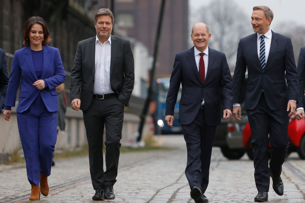 Christian Lindner, leader of the German Free Democrats (FDP), Olaf Scholz, SPD member and likely next German chancellor, Annalene Baerbock and Robert Habeck, co-leaders of the Greens Party, Christian Lindner, leader of the German Free Democrats (FDP), arrive to present their mutually-agreed on coalition contract on November 24, 2021 in Berlin, Germany. (Michele Tantussi—Getty Images)