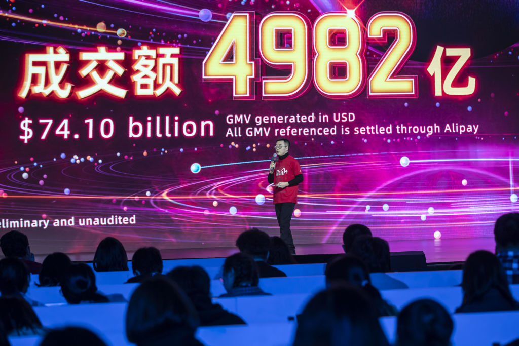 Jiang Fan, president of Taobao and Tmall at Alibaba Group Holding Ltd., speaks as a final transaction figure is displayed at the gala event for Alibaba's annual November 11 Singles' Day online shopping event in Hangzhou, China, on Thursday, Nov. 12, 2020. (Qilai Shen/Bloomberg via Getty Images)