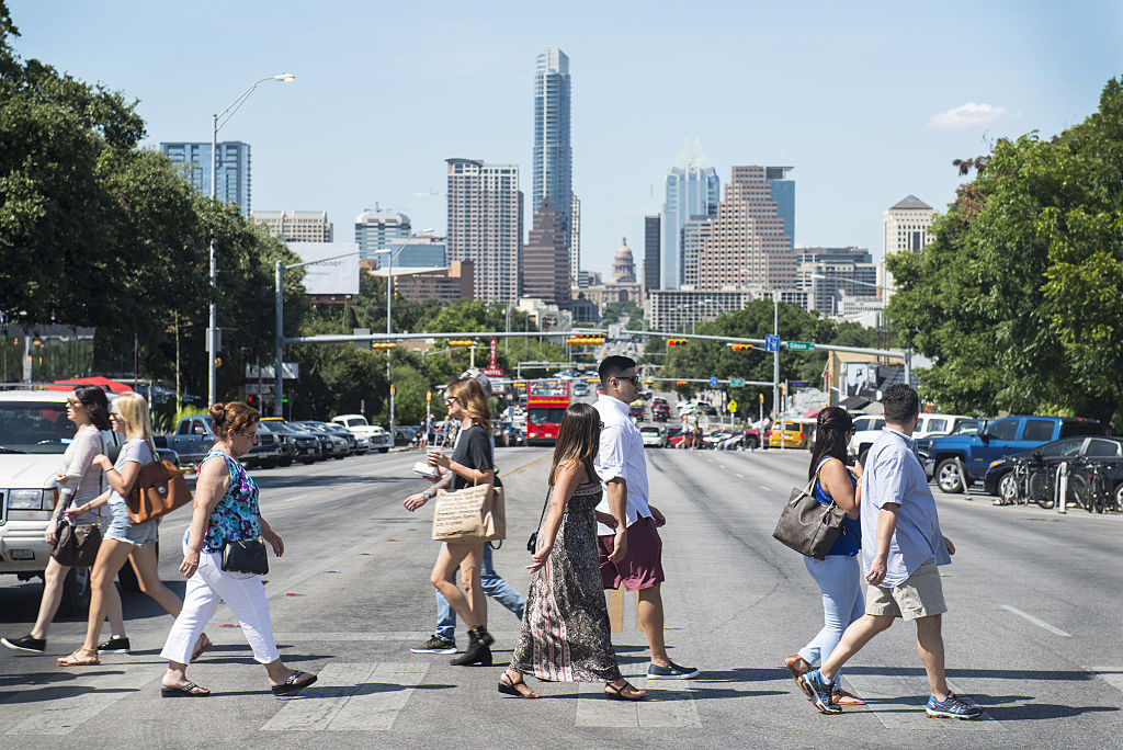 Pedestrians cross South Congress Avenue with the downtown skyline seen in the background in Austin, Texas, U.S. (Matthew Busch/Bloomberg—Getty Images)