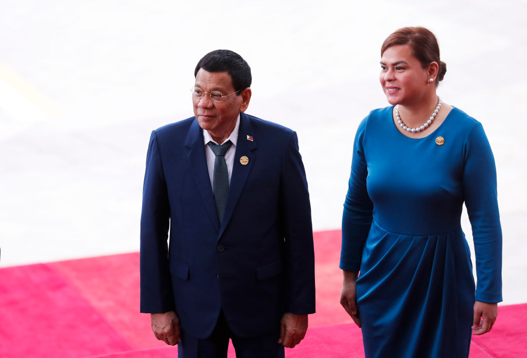 Philippine President Rodrigo Duterte (L) and his daughter Sara Duterte arrive for the opening of the Boao Forum for Asia (BFA) Annual Conference 2018 in Boao, south China's Hainan province on April 10, 2018. (AFP via Getty Images)