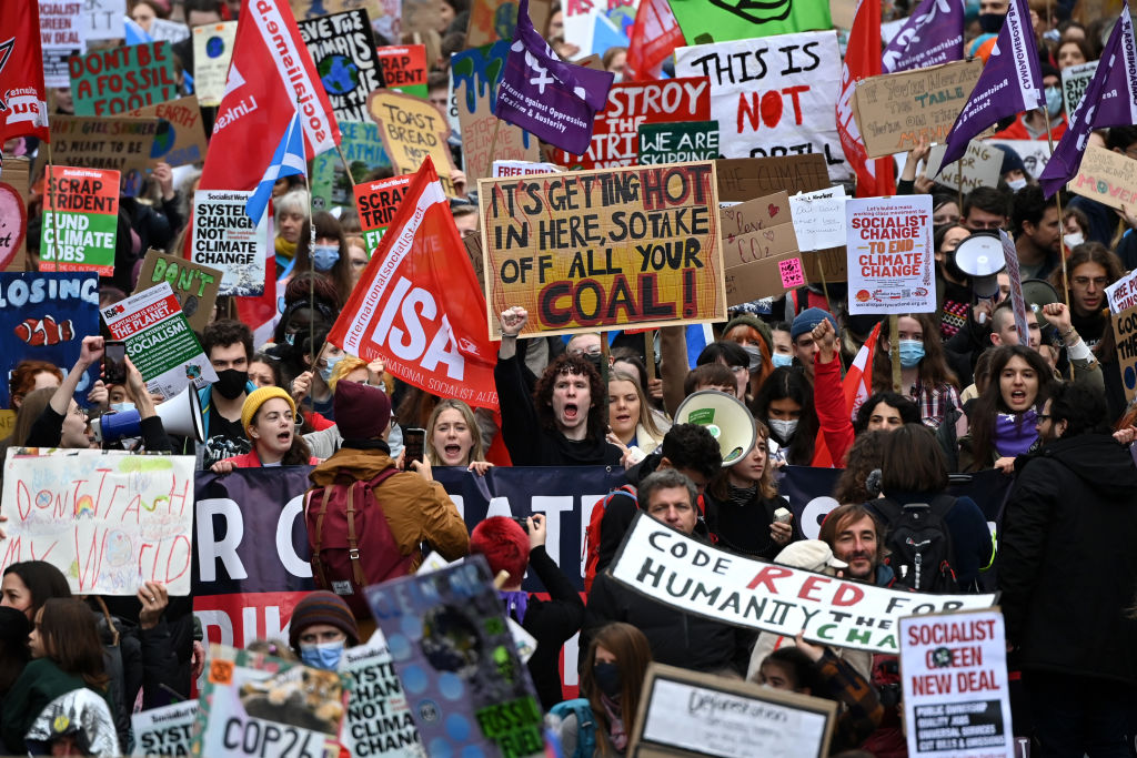 Demonstrators join the Fridays For Future march on November 5, 2021 in Glasgow, Scotland. (Jeff J Mitchell/—Getty Images)
