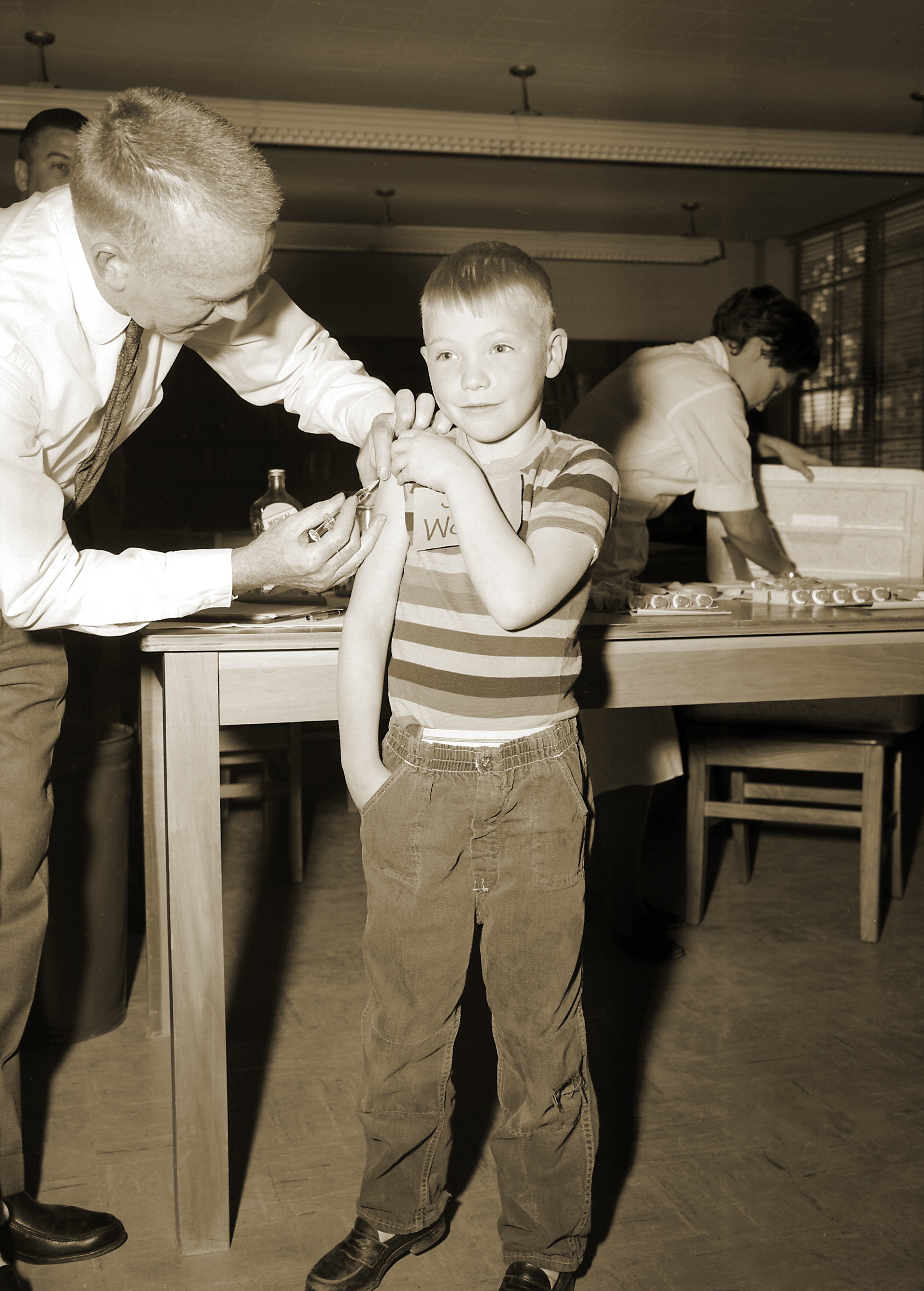 As part of the national immunization effort, this doctor was giving a measles vaccination to a young boy at Fernbank School in Atlanta, Georgia in 1962. (Smith Collection/Gado/Getty Images)