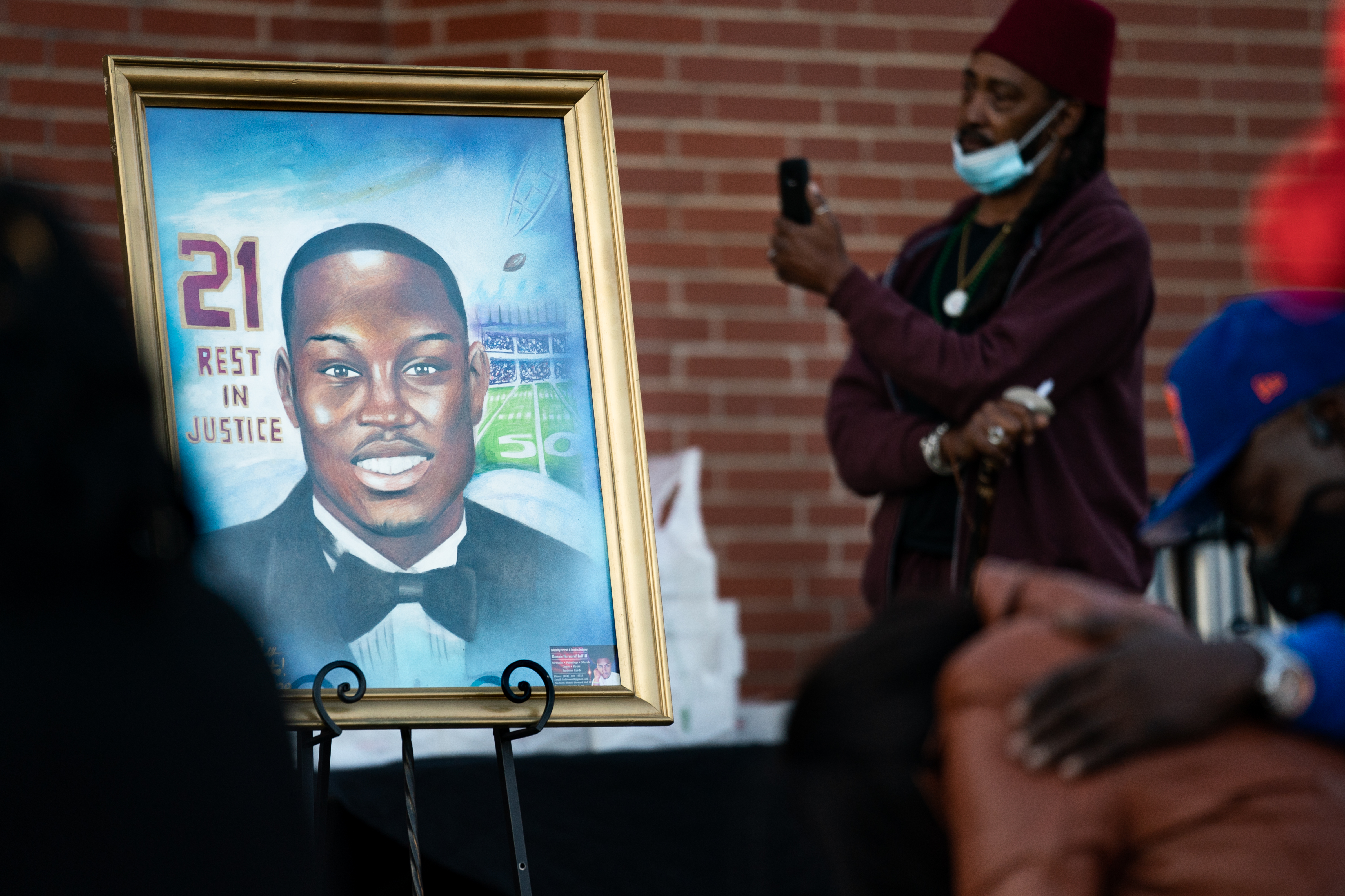 A painting of Ahmaud Arbery is displayed during a vigil at New Springfield Baptist Church on Feb. 23, 2021 in Waynesboro, Georgia. (Sean Rayford—Getty Images)