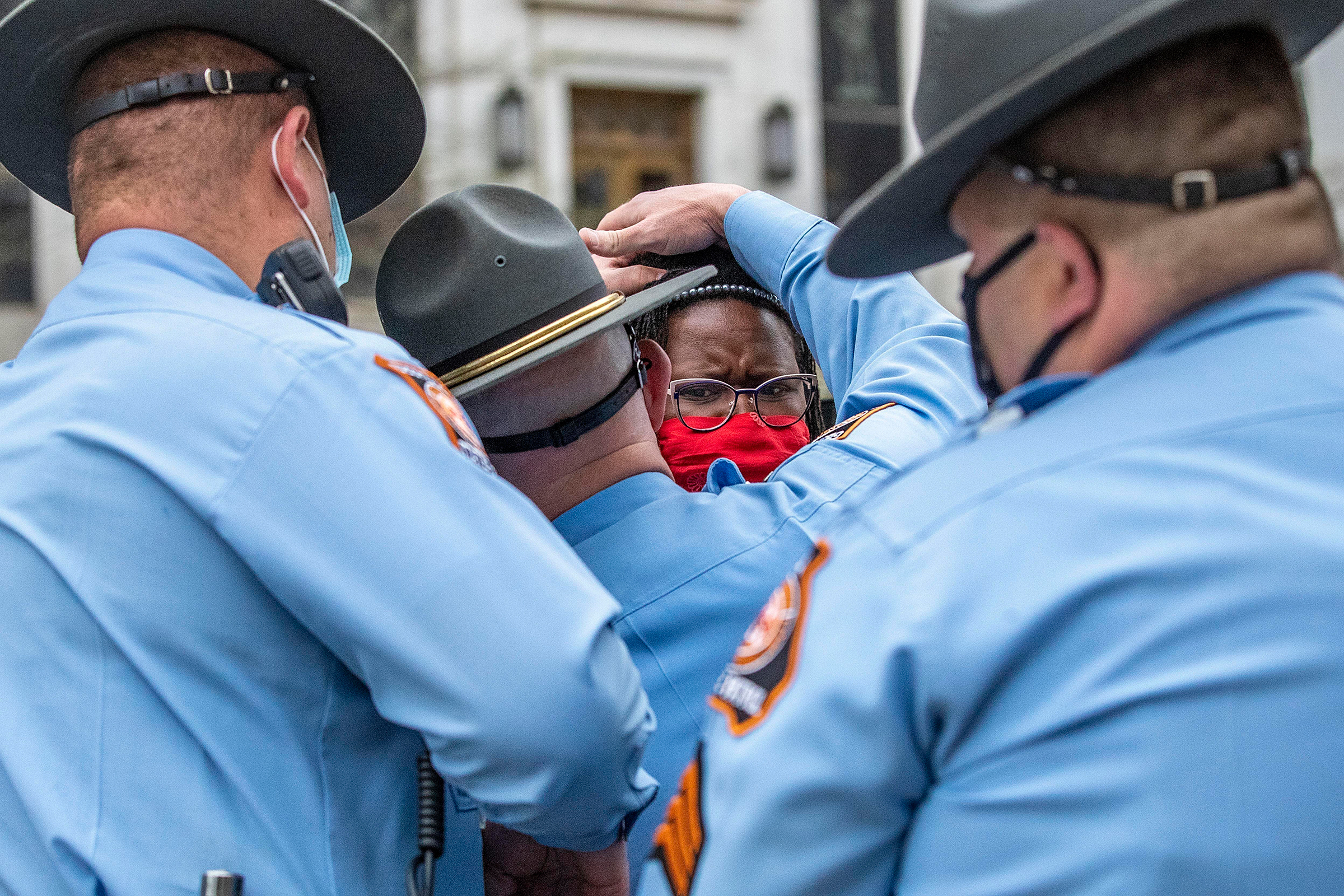 State Rep. Park Cannon, D-Atlanta, is placed into the back of a Georgia State Capitol patrol car after being arrested by Georgia State Troopers at the Georgia State Capitol Building in Atlanta on March 25, 2021. Cannon was arrested by Capitol police after she attempted to knock on the door of Gov. Brian Kemp's office during his remarks after he signed into law a sweeping Republican-sponsored overhaul of state elections. The Fulton County District attorney announced in April that Cannon would not be prosecuted.