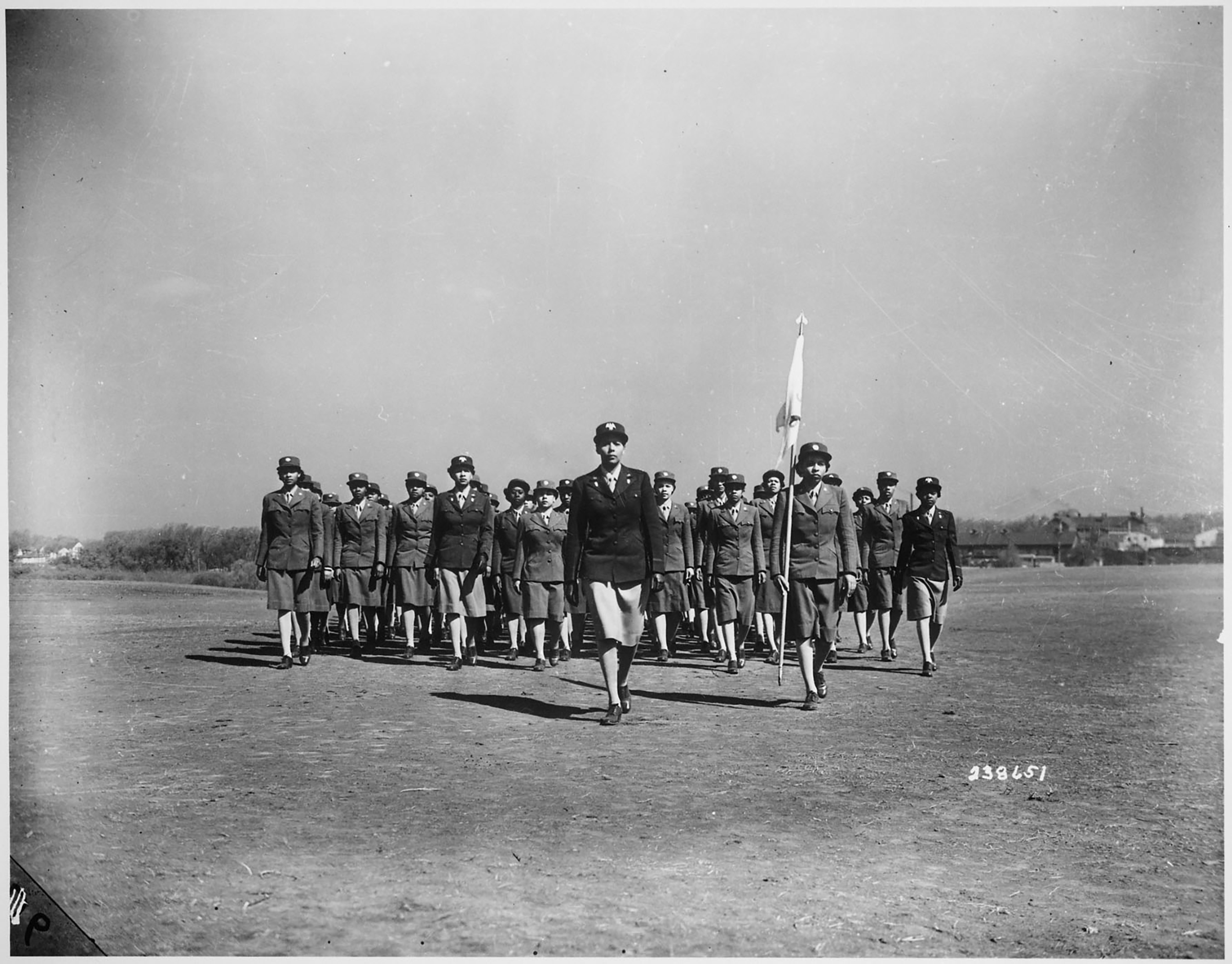 WAAC Capt. Charity Adams of Columbia, N.C., who was commissioned from the first officer candidate class, drills her company on the drill ground at the first WAAC (later WAC) Training Center, Fort Des Moines, Iowa. (nsf/Alamy)