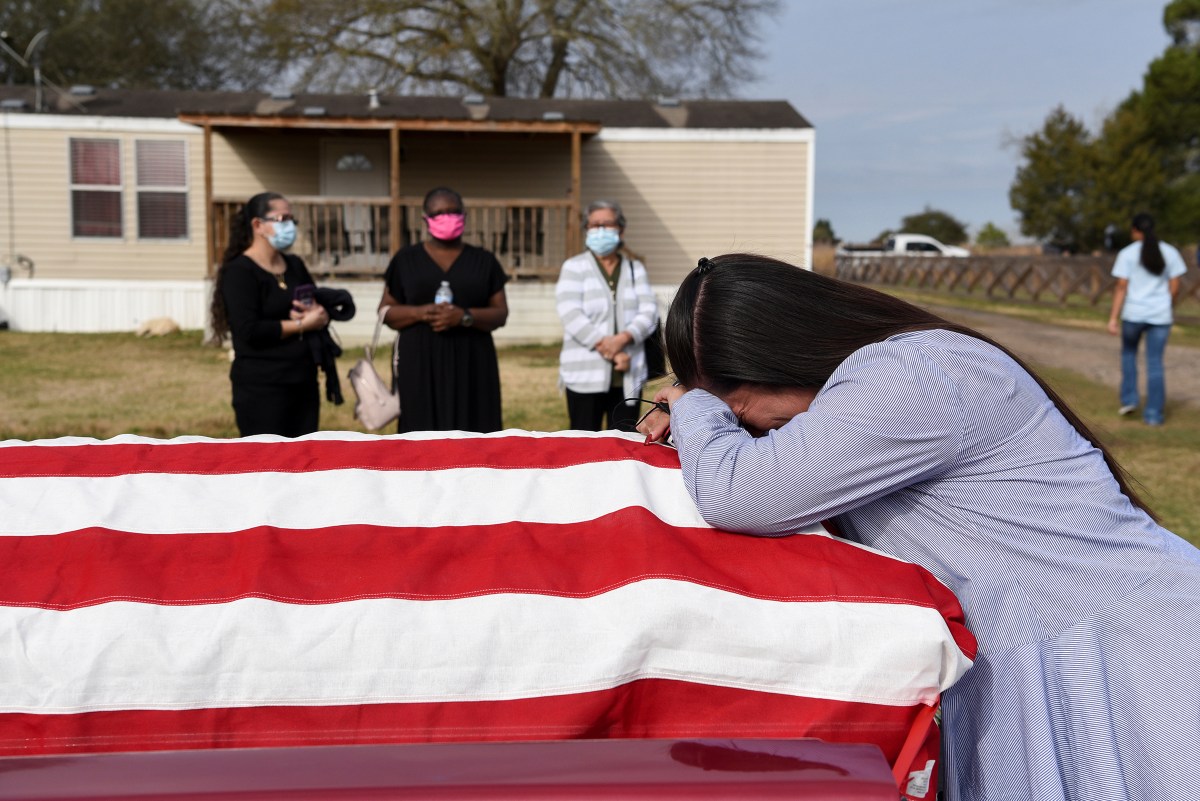Lila Blanks reacts ahead of the funeral of her husband, Gregory Blanks, 50, who died from COVID-19 complications, in San Felipe, Texas, on Jan. 26. 