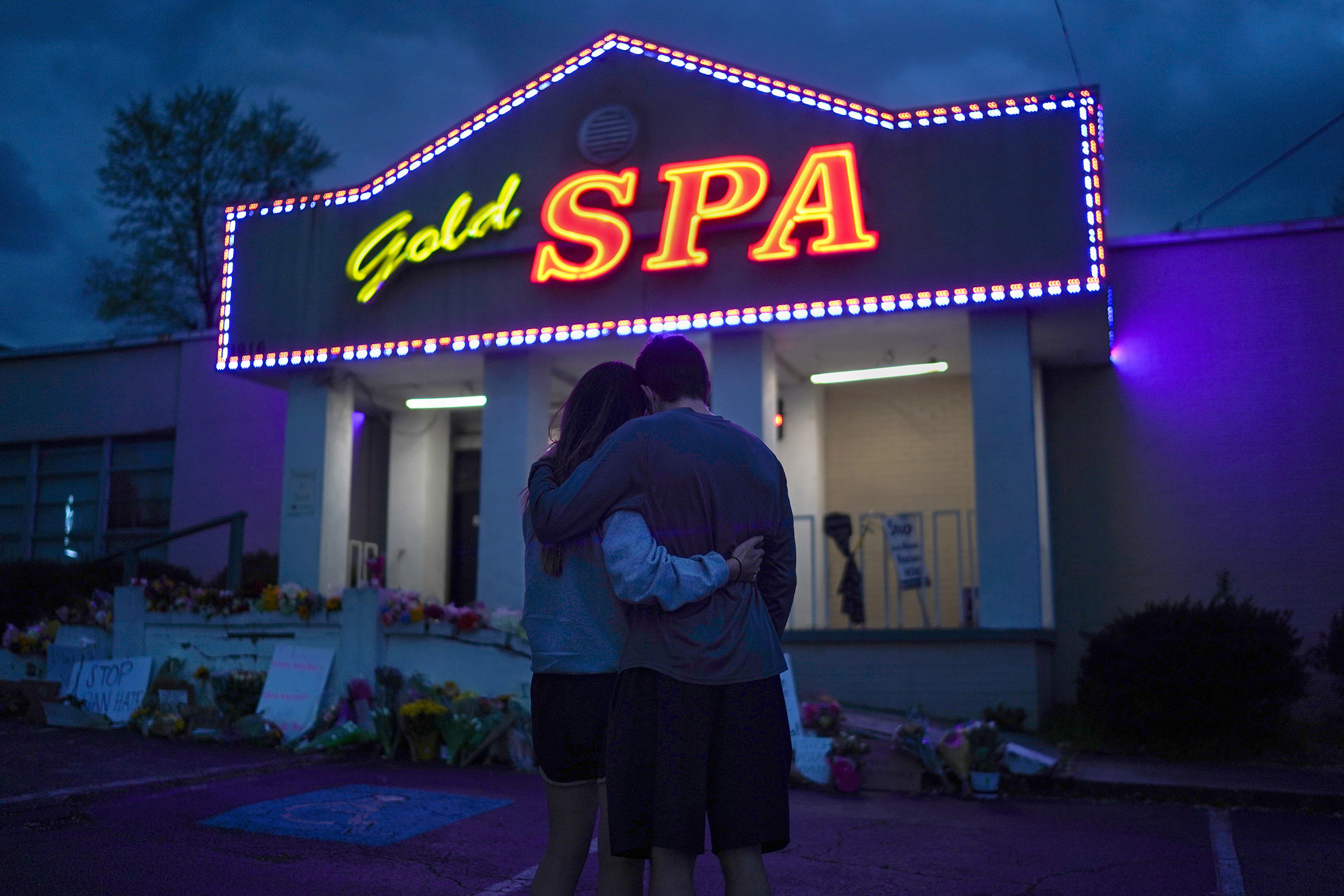Cynthia Shi and her boyfriend, Graham Bloomsmith, embrace outside Gold Spa near Acworth, Ga., on March 18, 2021. Two days earlier, a gunman killed eight people—including six women of Asian descent—and injured one person in shootings at three Atlanta-area massage businesses amid a pandemic spike in attacks on Asian Americans.