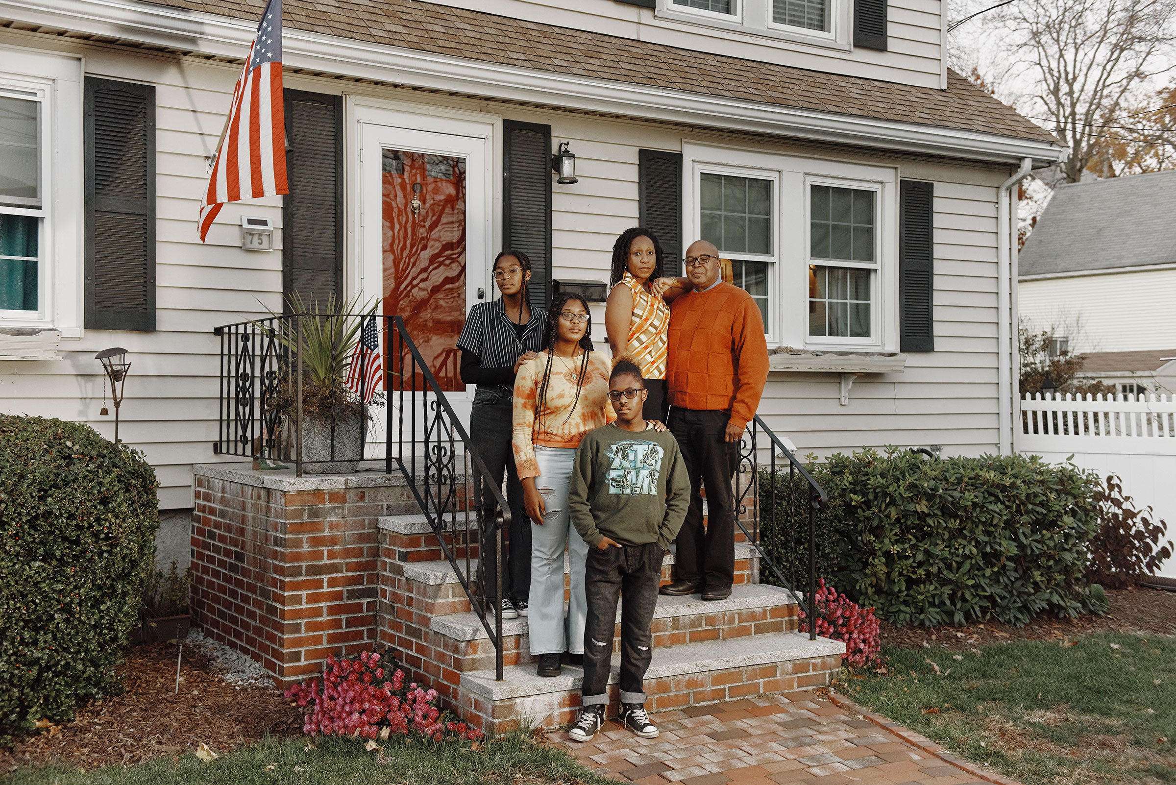 The Henry family outside their home in Malden on Nov. 18 (Tony Luong for TIME)