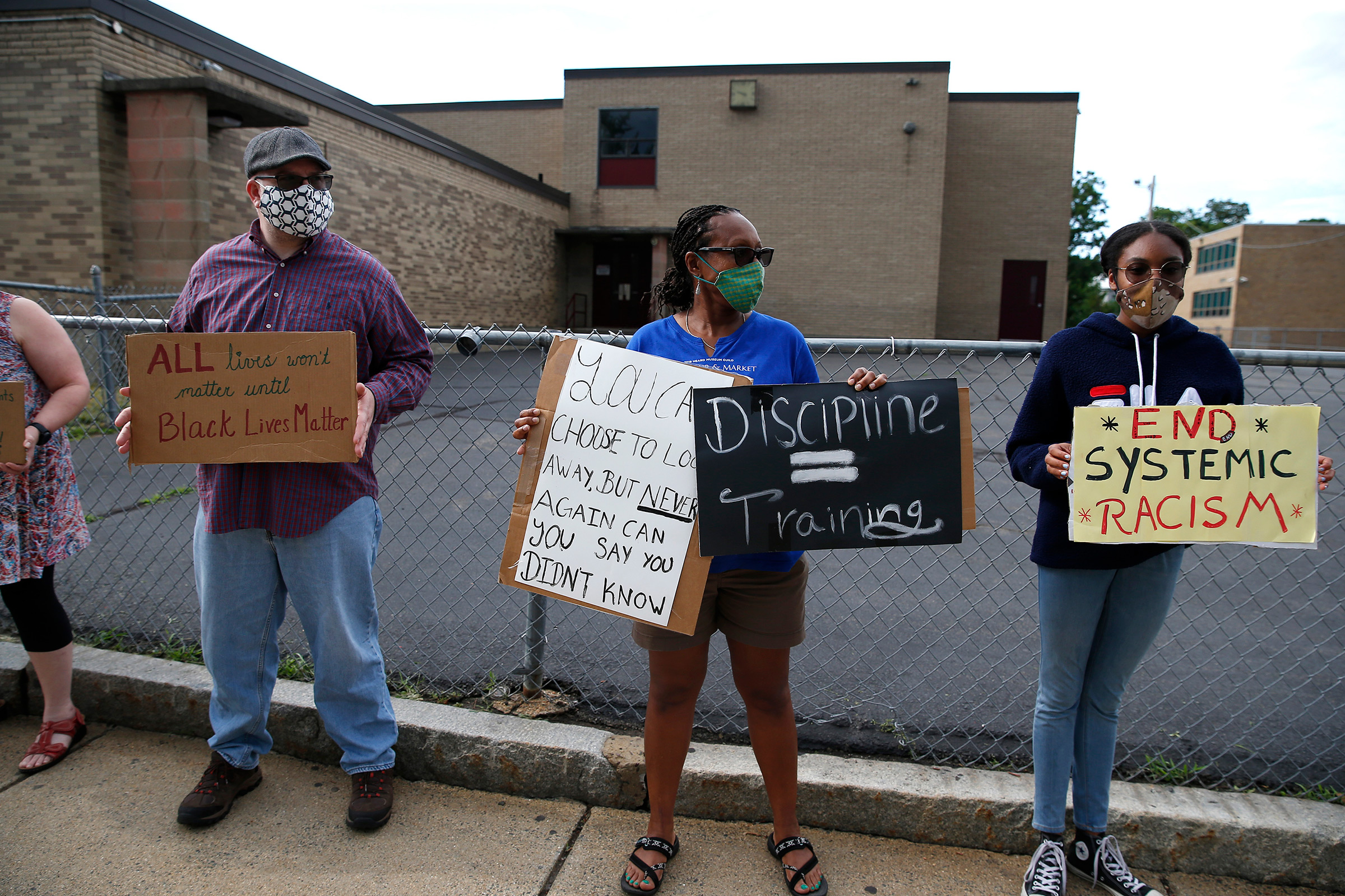 Andrea and Thora Henry protest with others outside of Mystic Valley Charter School in Malden on July 1, 2020 (Jessica Rinaldi—The Boston Globe/Getty Images)