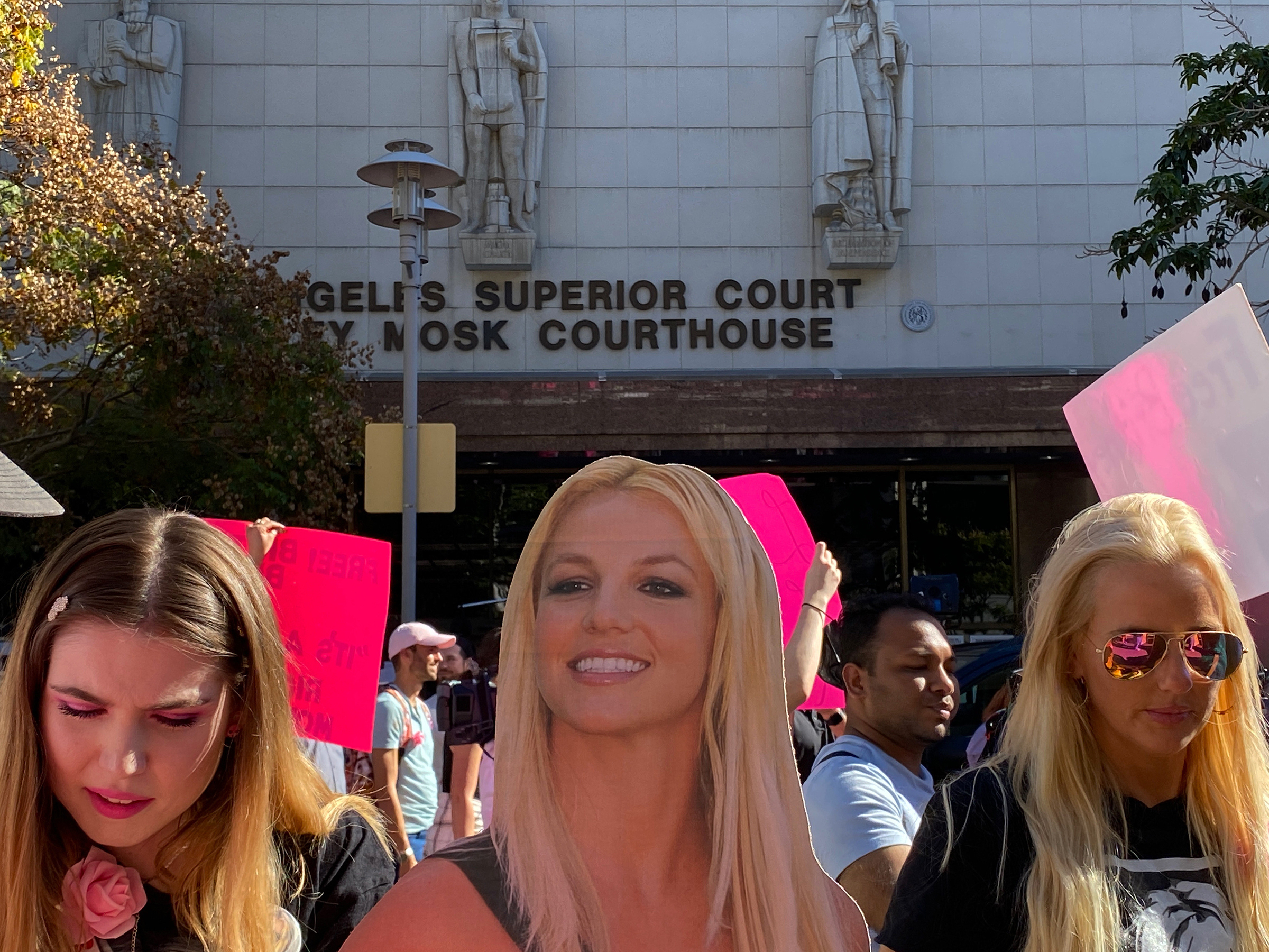 Supporters of Britney Spears gather outside an L.A. courthouse on Nov. 12 where a judge that day ended the conservatorship that denied her control of her health and finances for 13 years.