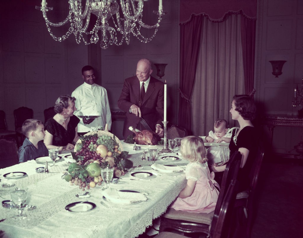 President Eisenhower Cutting Turkey for Family Dinner