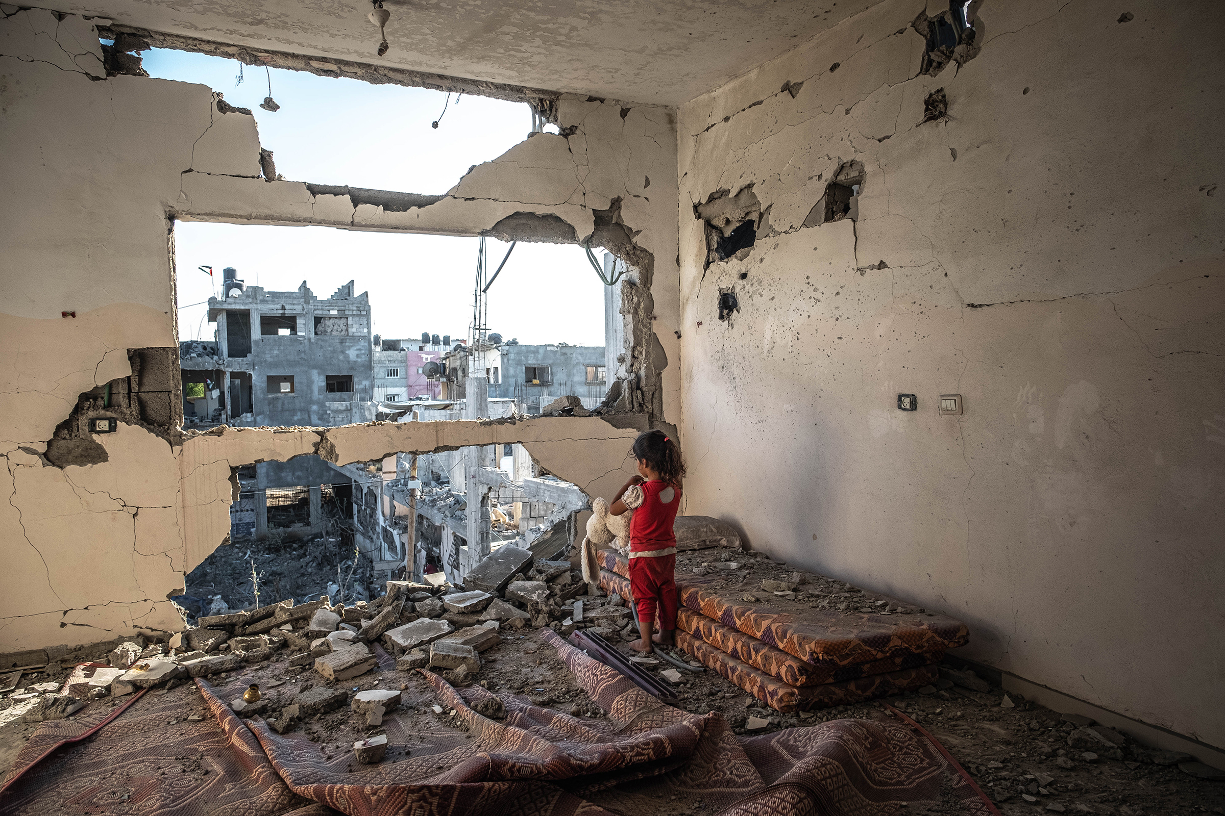 With a cease-fire in effect, a Palestinian girl stands in her destroyed home in Beit Hanoun, Gaza, on May 24. More than 12 in Israel and 250 Palestinians were killed in the deadliest escalation in the conflict since 2014, as unguided rocket fire from Hamas, which governs the 2 million people in Gaza, was answered by Israeli air and artillery strikes. The battle erupted after Israeli authorities moved against Palestinians at sensitive sites inside Israel, including Jerusalem’s al-Aqsa Mosque.