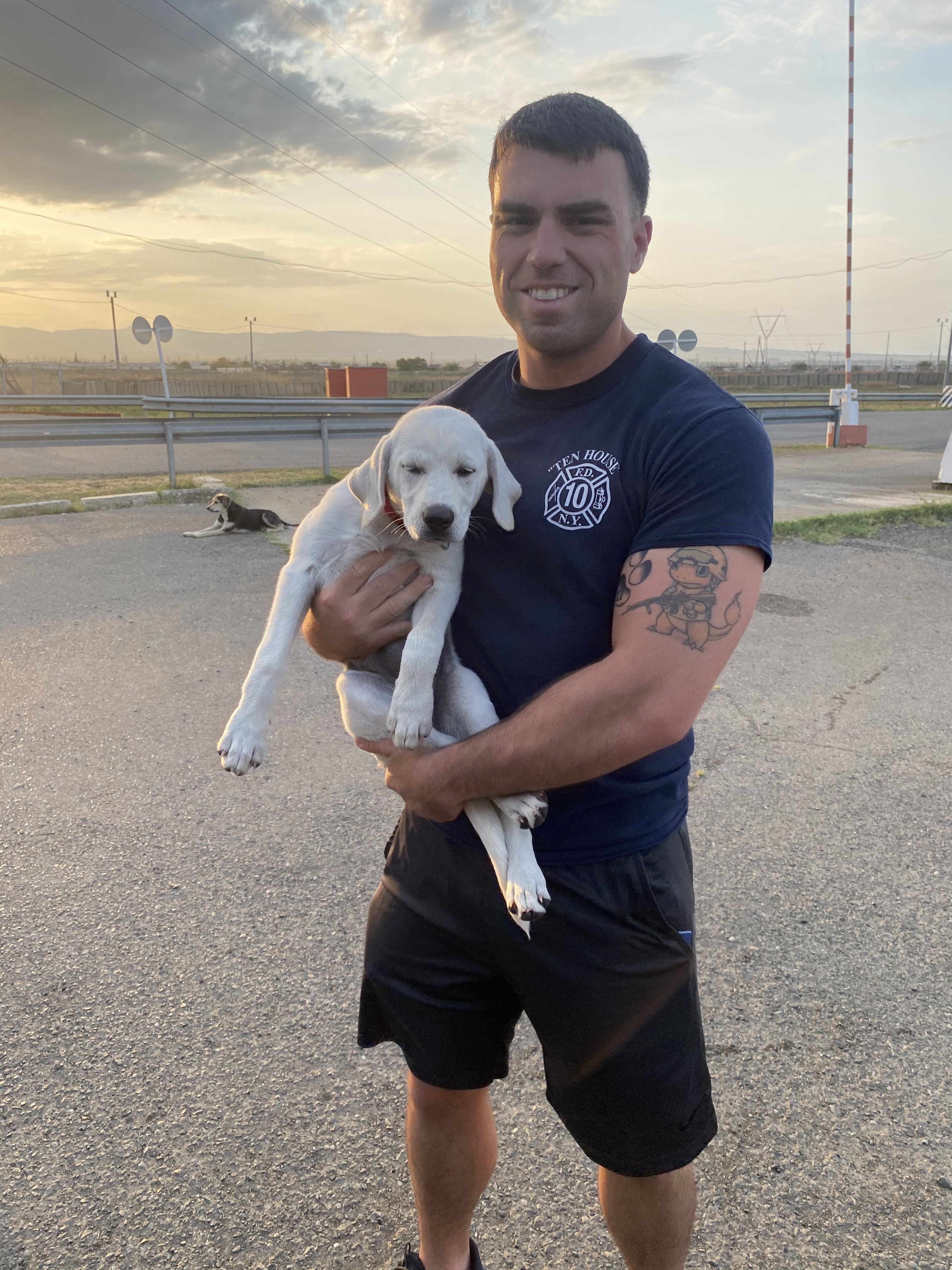 Sgt. John Kurulgan, a Marine Corps reservist, with his dog Peggy in 2021. (Photo courtesy SPCA International)