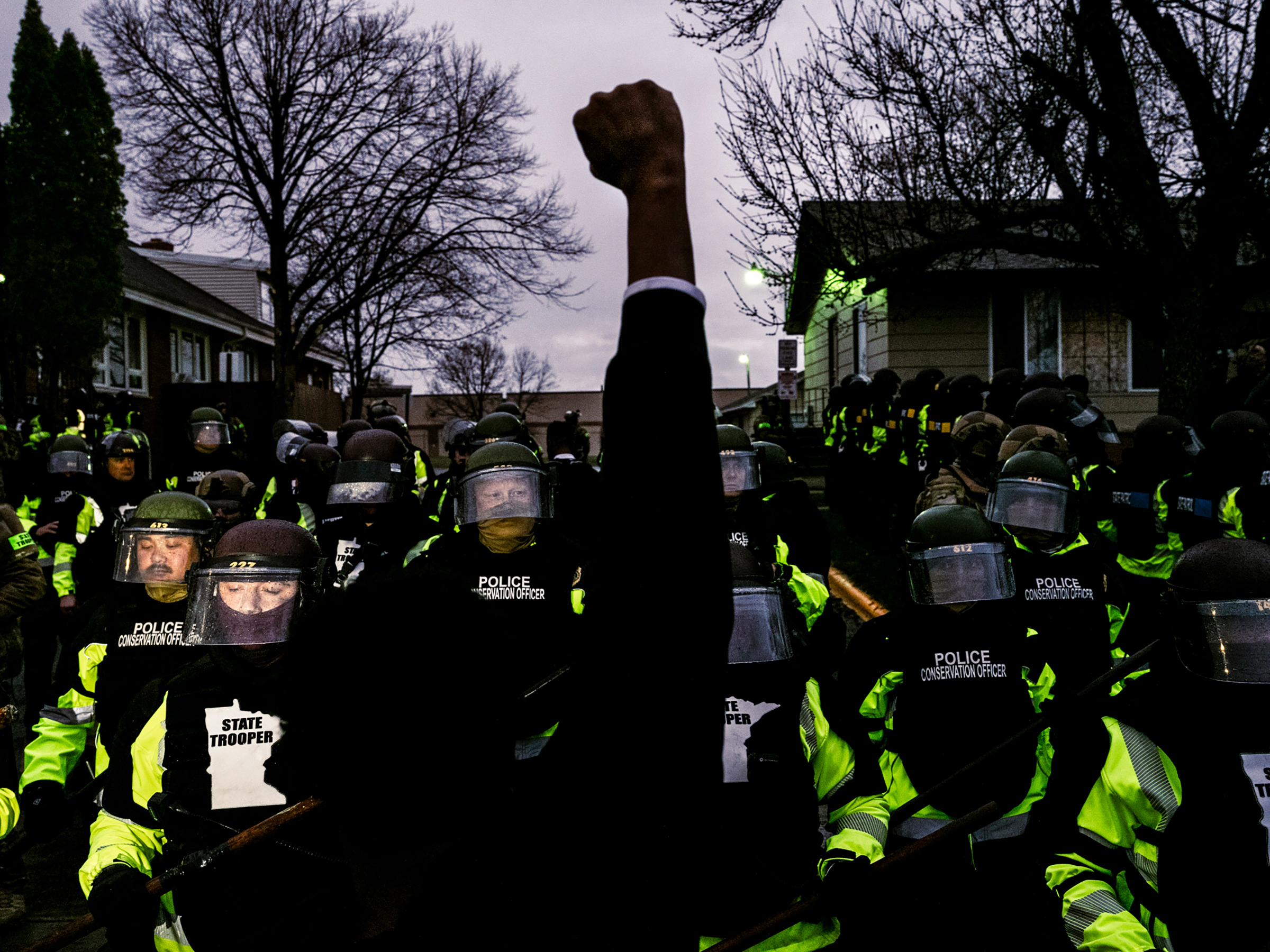 Protesters confront law enforcement officers in Brooklyn Center, Minn., on April 12, one day after 20-year-old Black man Daunte Wright was killed during a traffic stop. (Joshua Rashaad McFadden—The New York Times/Redux)
