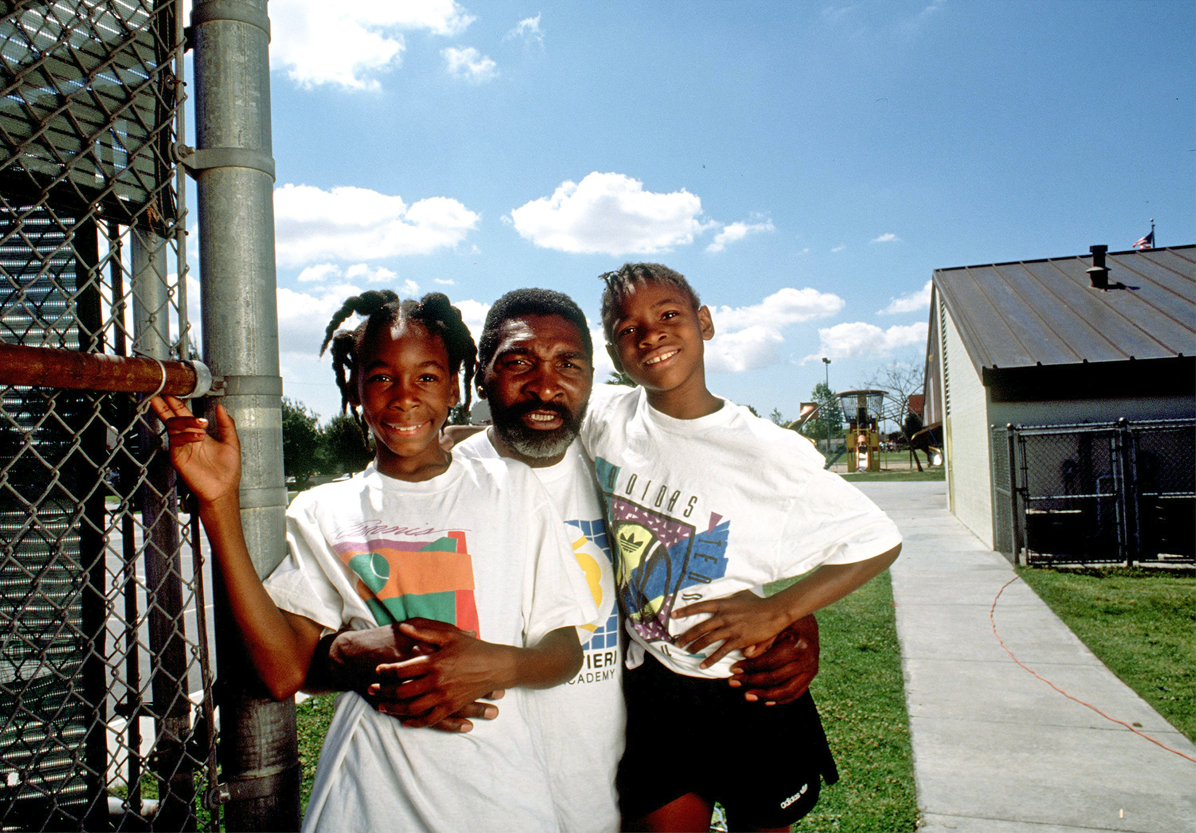 Richard Williams, center, with his daughters Venus, left, and Serena in Compton, CA in 1991. (Paul Harris—Getty Images)