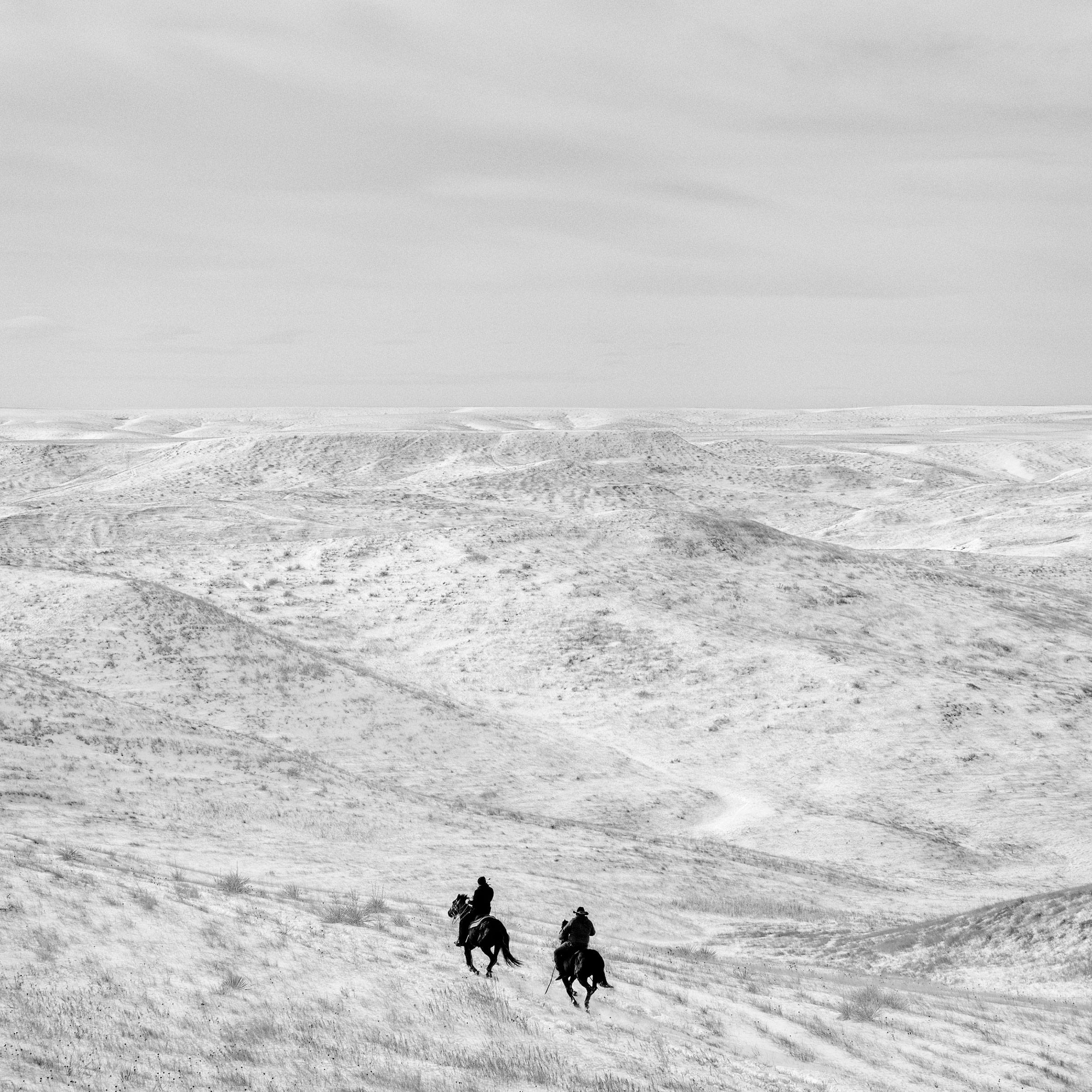 Two horseback riders. Ziebach County, S.D. 2016.