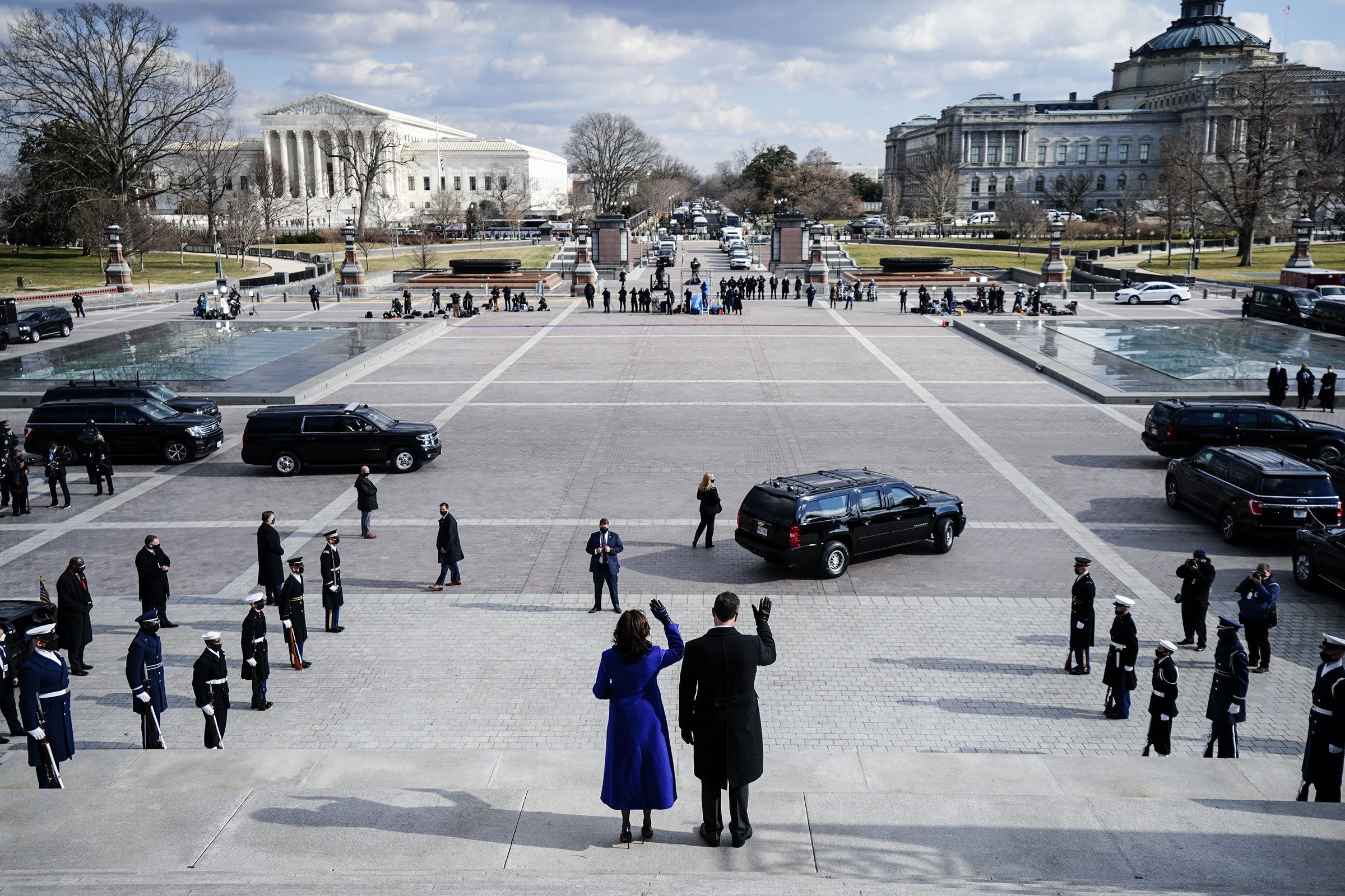 Vice President Kamala Harris and her husband, Doug Emhoff, wave after the inauguration in Washington, D.C., on Jan. 20. Harris made history as the first woman, and first person of Asian descent, to assume the country's second-highest office.