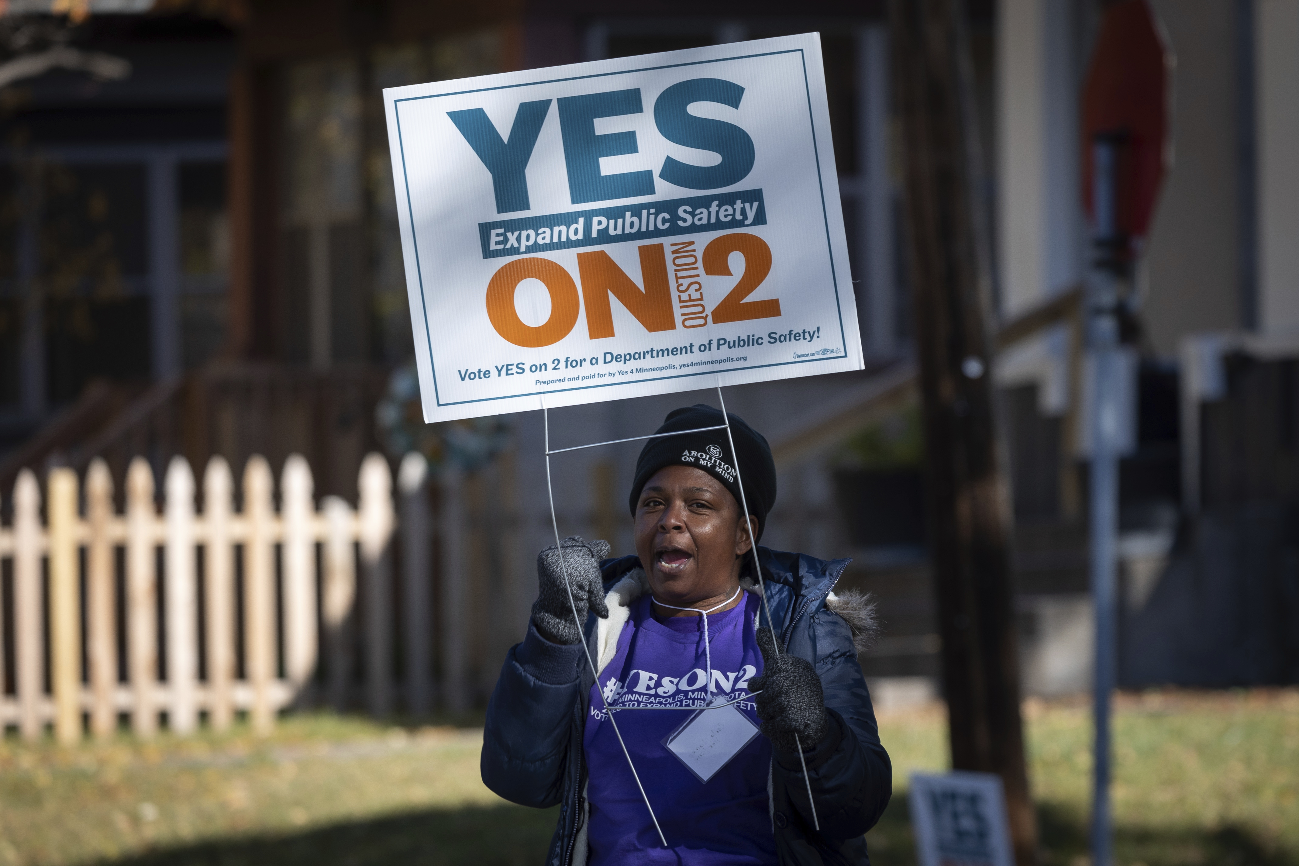A volunteer urges community members to vote yes on a ballot question offering an alternative to the city's police department outside of a polling place on Tuesday, Nov. 2, 2021 in Minneapolis. (Christian Monterrosa—AP)
