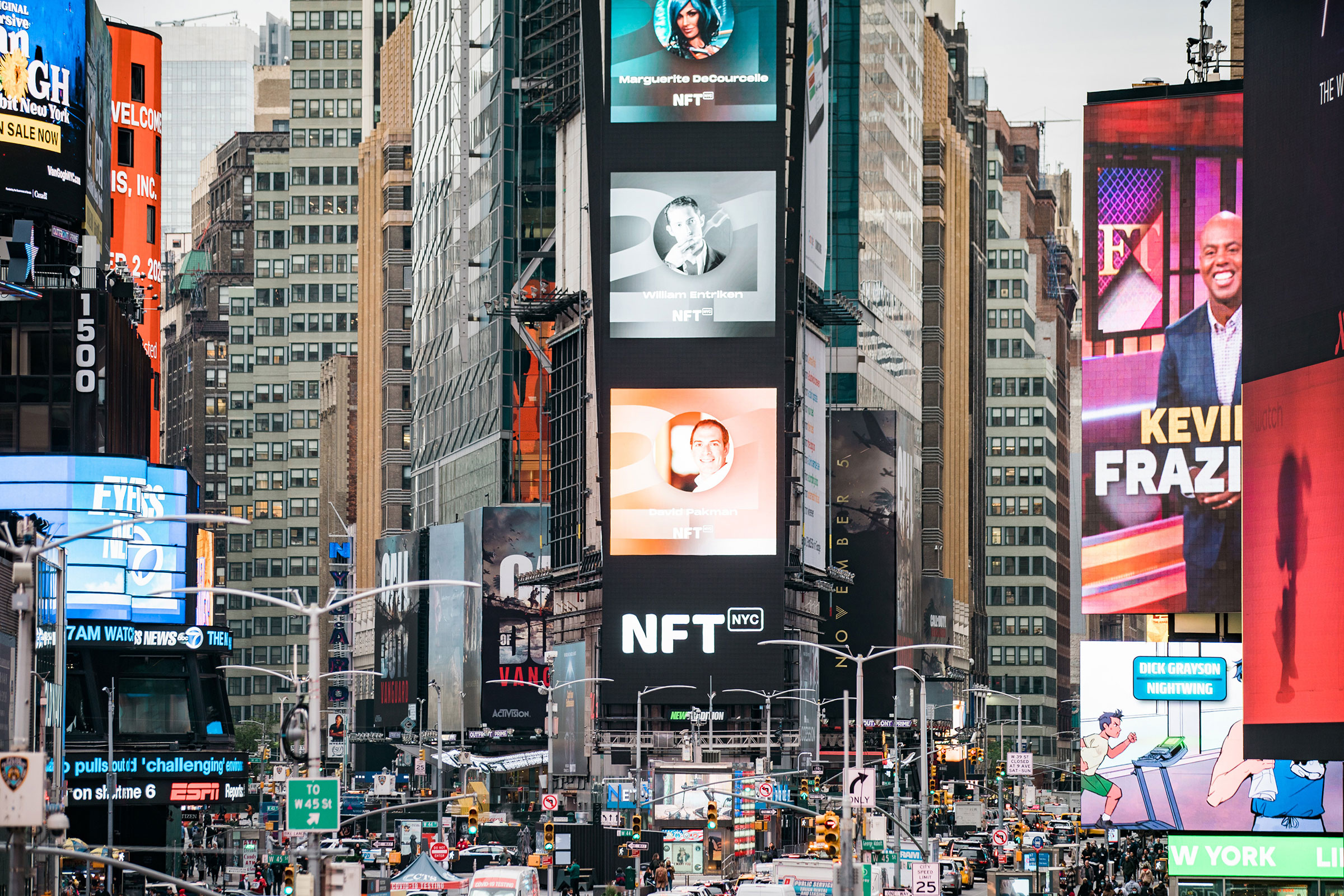 Ads in New York's Times Square promoting the nonfungible token conference NFT.NYC, Nov. 2, 2021. NFT.NYC, a gathering for nonfungible token enthusiasts, offered a taste of a crypto-filled future. (Jeenah Moon—The New York Times/Redux)