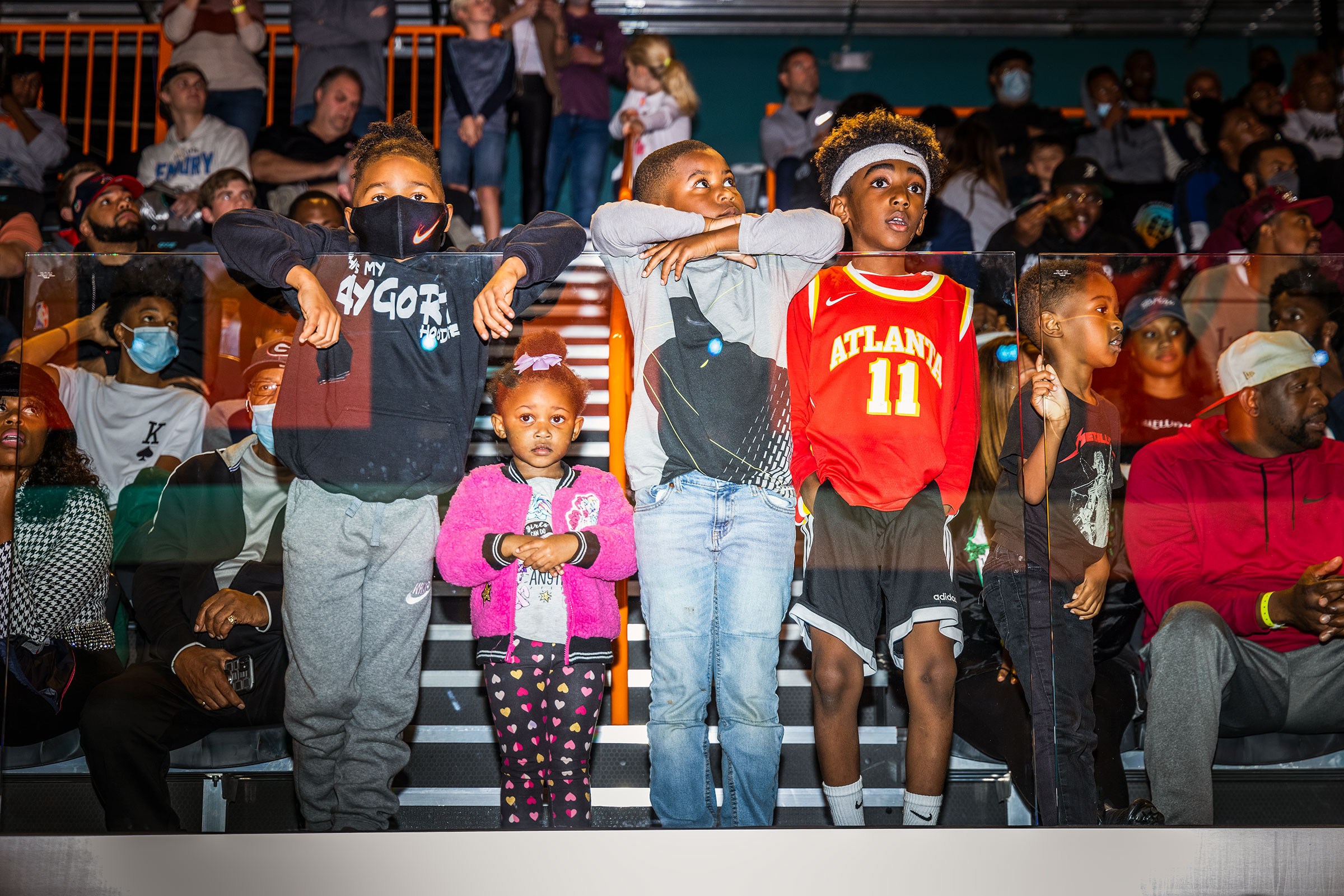 Young fans in the stands watch the action at the OTE arena. (Andrew Hetherington for TIME)