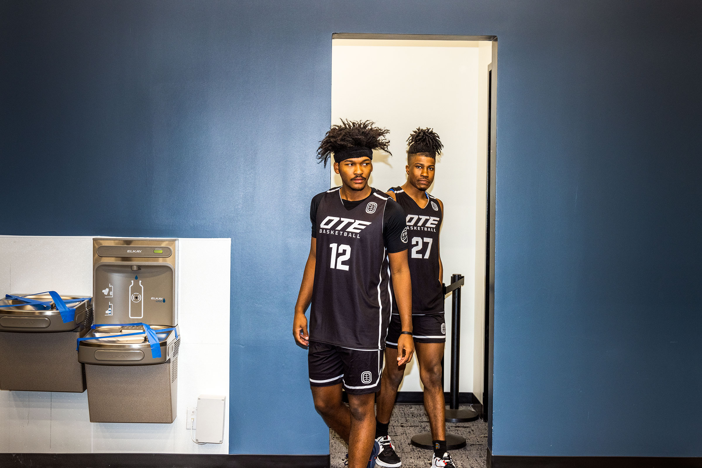 Bryce Griggs and TJ Clark leave the locker room on to the OTE practice courts in Atlanta. (Andrew Hetherington for TIME)