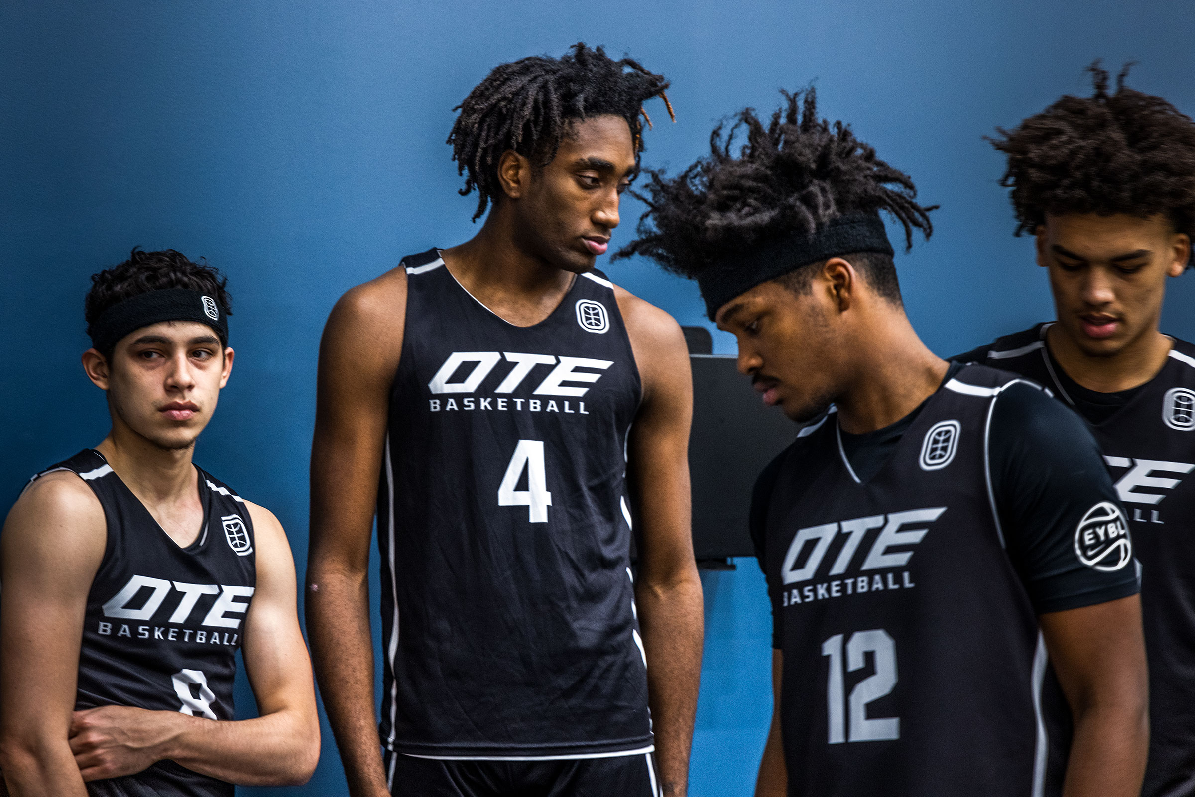 Emmanuel Maldonado, Ryan Bewley, Bryce Griggs, Jalen Lewis of Overtime Elite taking a quick break from warm ups at the practice courts at the OTE arena. (Andrew Hetherington for TIME)