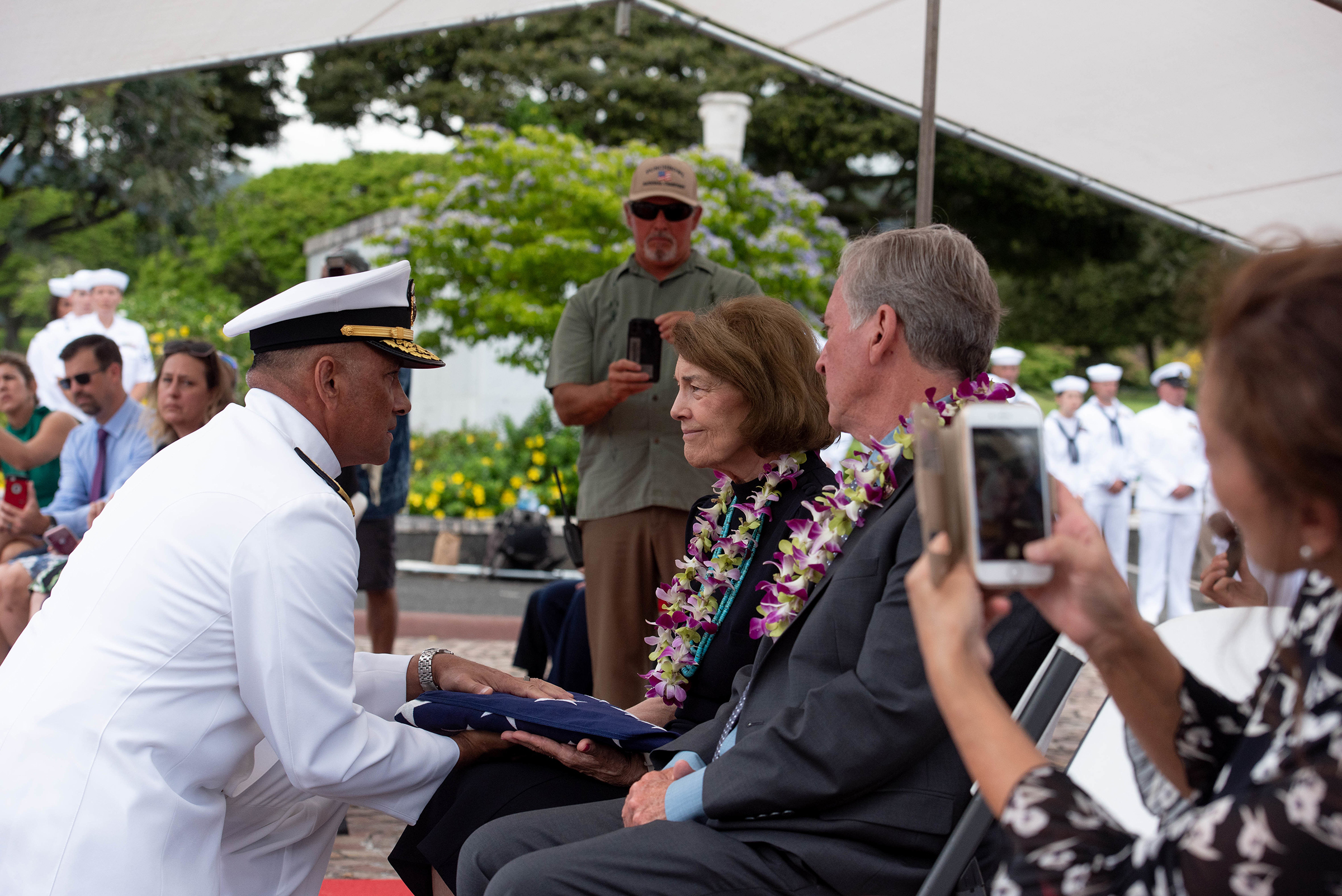 Carol Sowar receives an American flag at her uncles’ funeral at the national cemetery in Honolulu (Tech. Sgt. Rusty Frank—U.S. Air Force/Department of Defense)