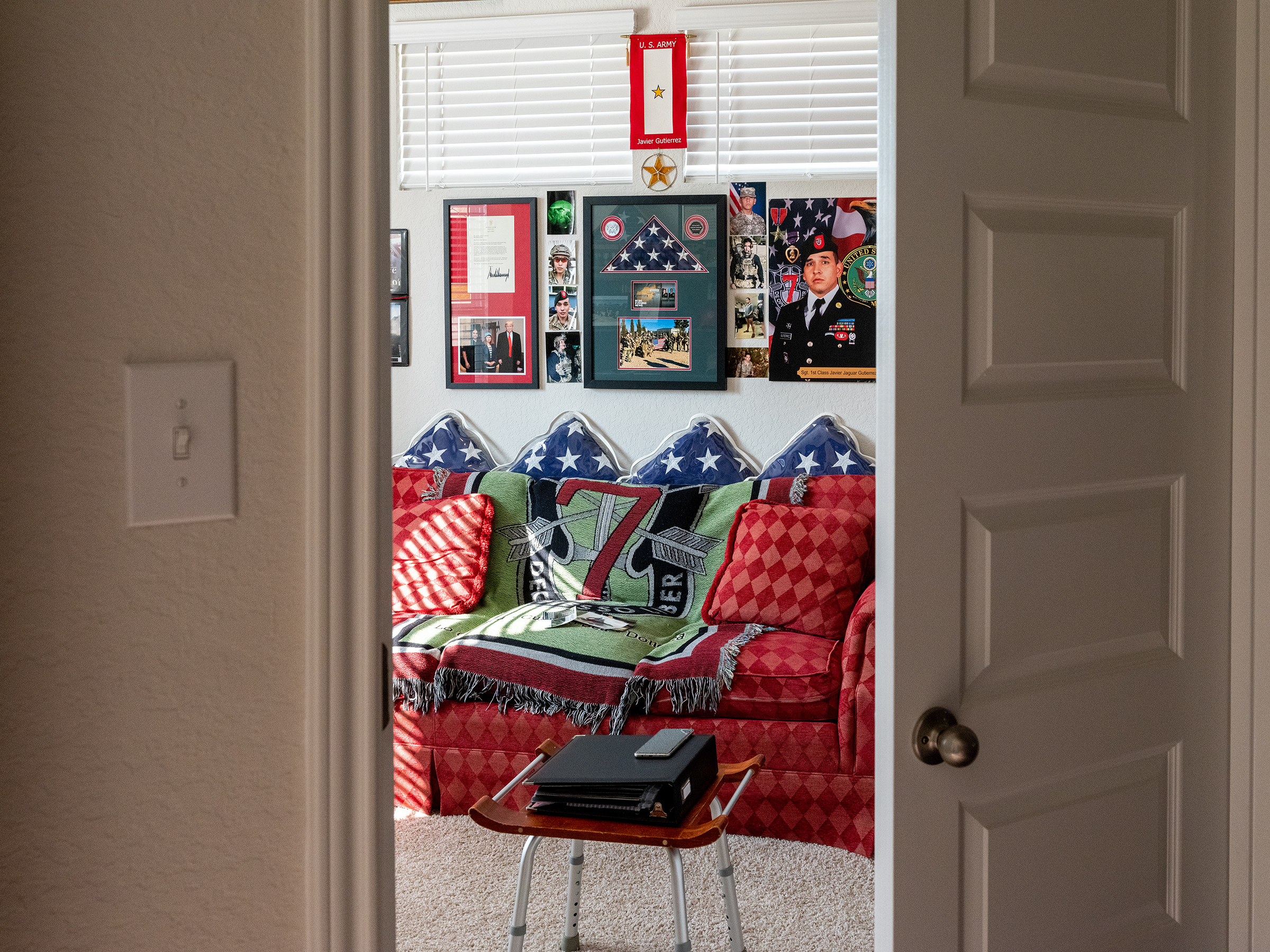 In San Antonio, Texas, on Aug. 26, the sunroom in the two-story brick home of Javier "Jaguar" Gutierrez's parents is decorated with remembrances of their fallen son, an American service member who was killed in February 2020 by an Afghan soldier just weeks before a peace deal was signed between the U.S. and the Taliban.