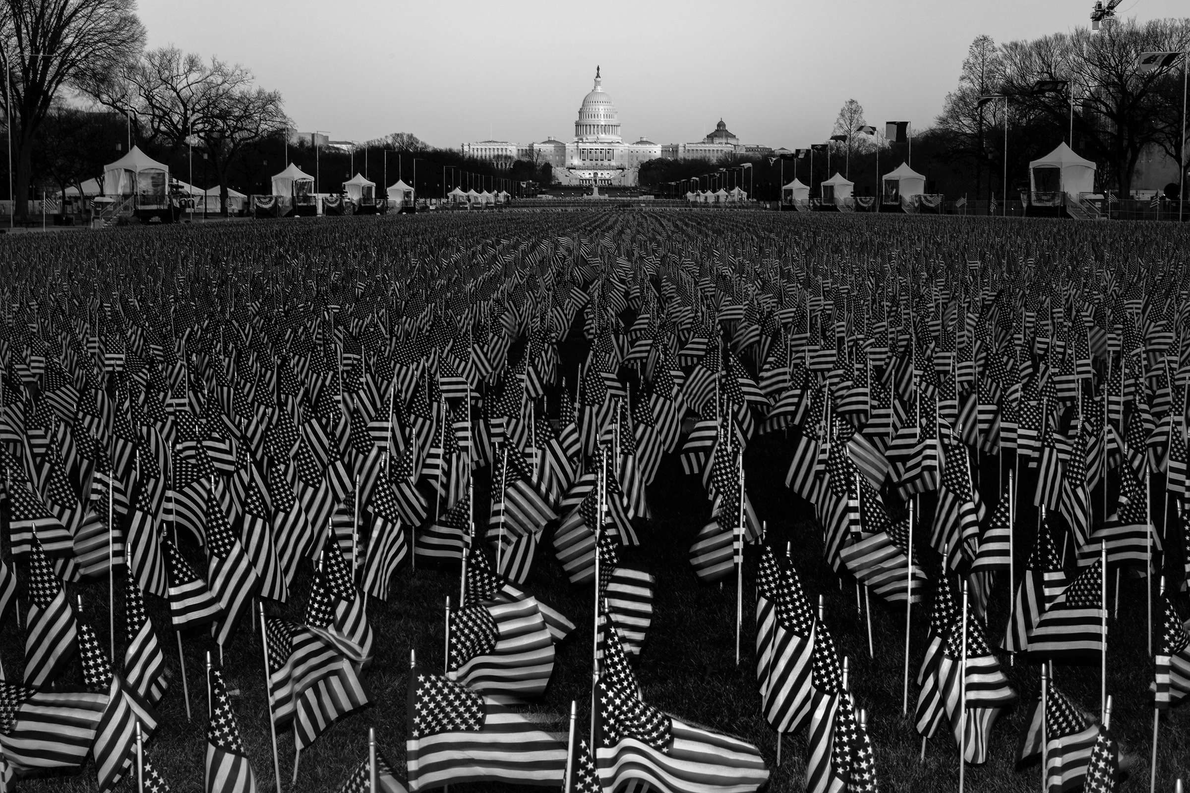 A field of flags on the National Mall in Washington, D.C., on Jan. 19, one day before the inauguration of President-elect Joe Biden and Vice President-elect Kamala Harris. The public art display featured nearly 200,000 flags, representing Americans who would have gathered for the inauguration, according to the organizing committee.