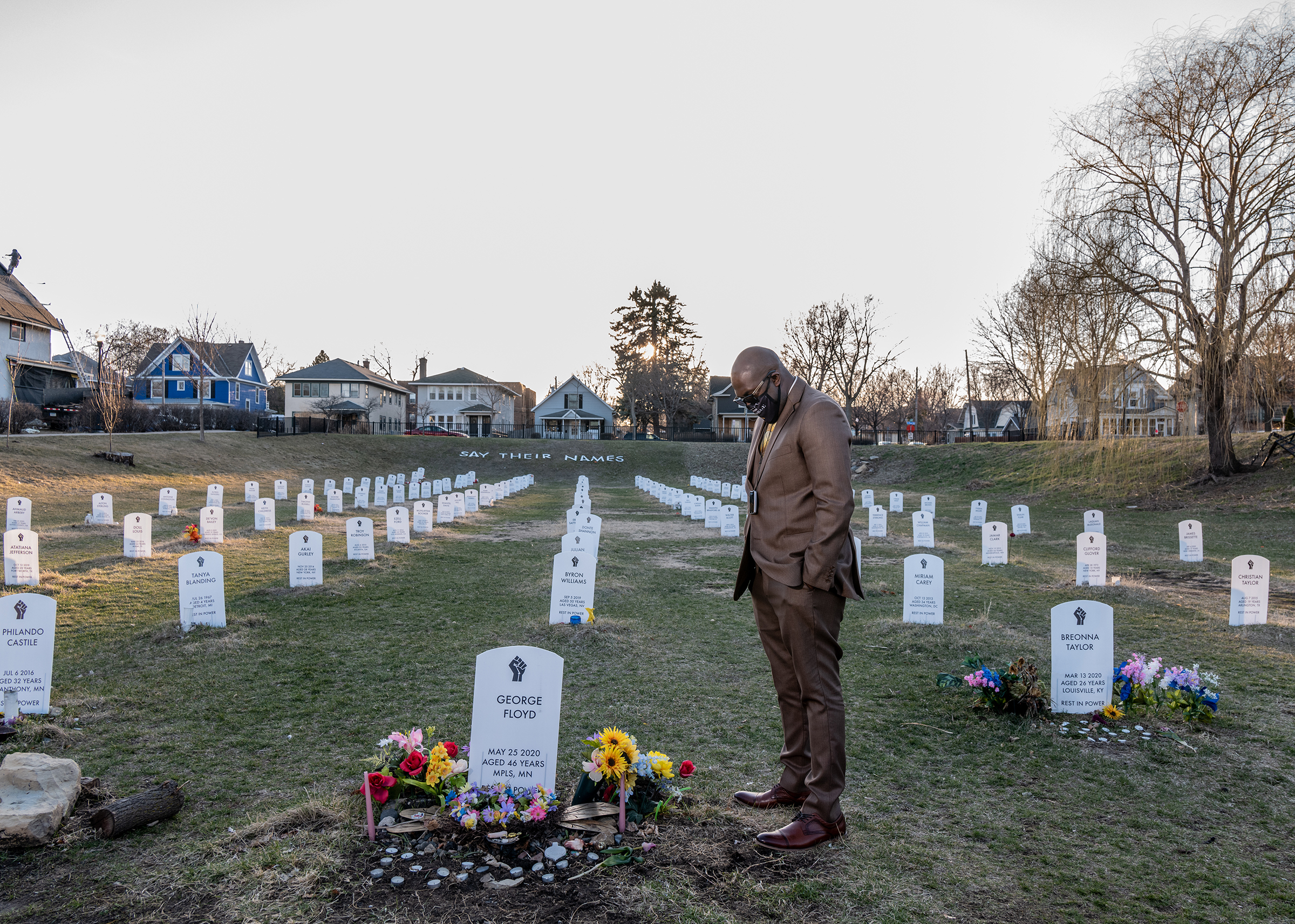 George Floyd's brother, Philonise Floyd, visits a protest art installation on April 1. The tombstones bear the name of Black Americans lynched by private citizens, fatally shot, or choked by police officers or other victims who died in police custody. Former Minneapolis police officer Derek Chauvin was convicted on April 20 of murdering George Floyd—a <a href=