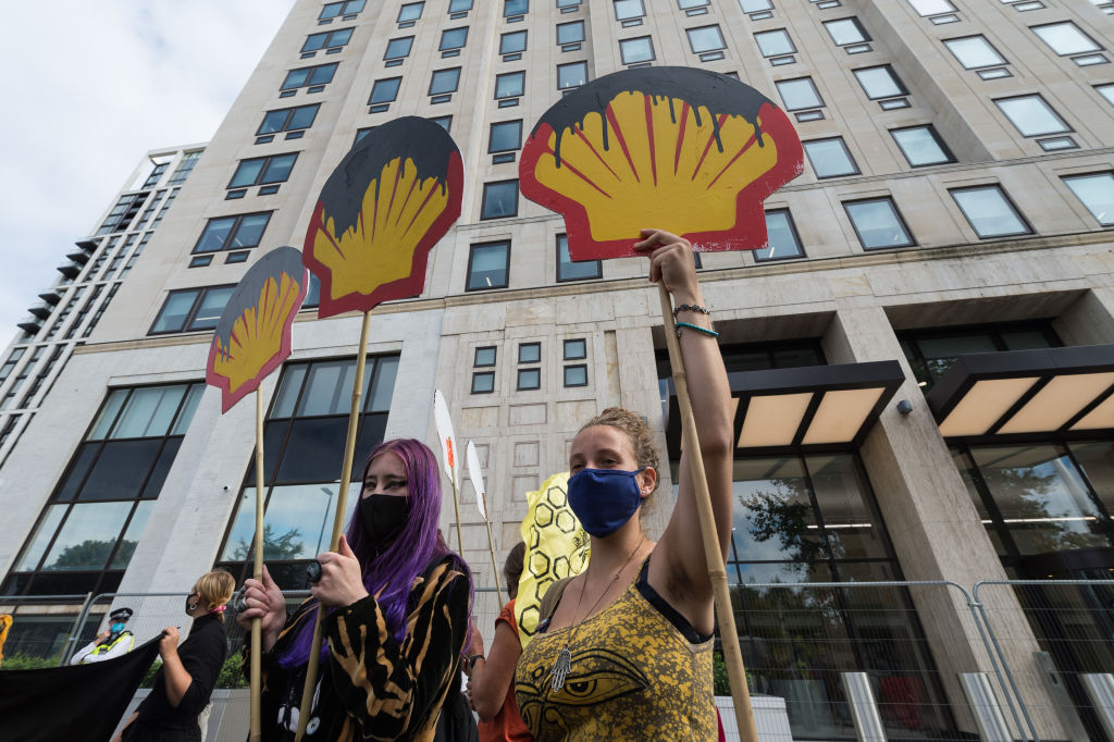 Activists from Extinction Rebellion stage a protest outside corporate offices of oil company Shell demanding an end to extraction of fossil fuels and reparations for the communities affected by environmental pollution caused by oil spills in the Niger Delta, on Sept. 8 2020 in London, England. (WIktor Szymanowicz—NurPhoto/Getty Images)