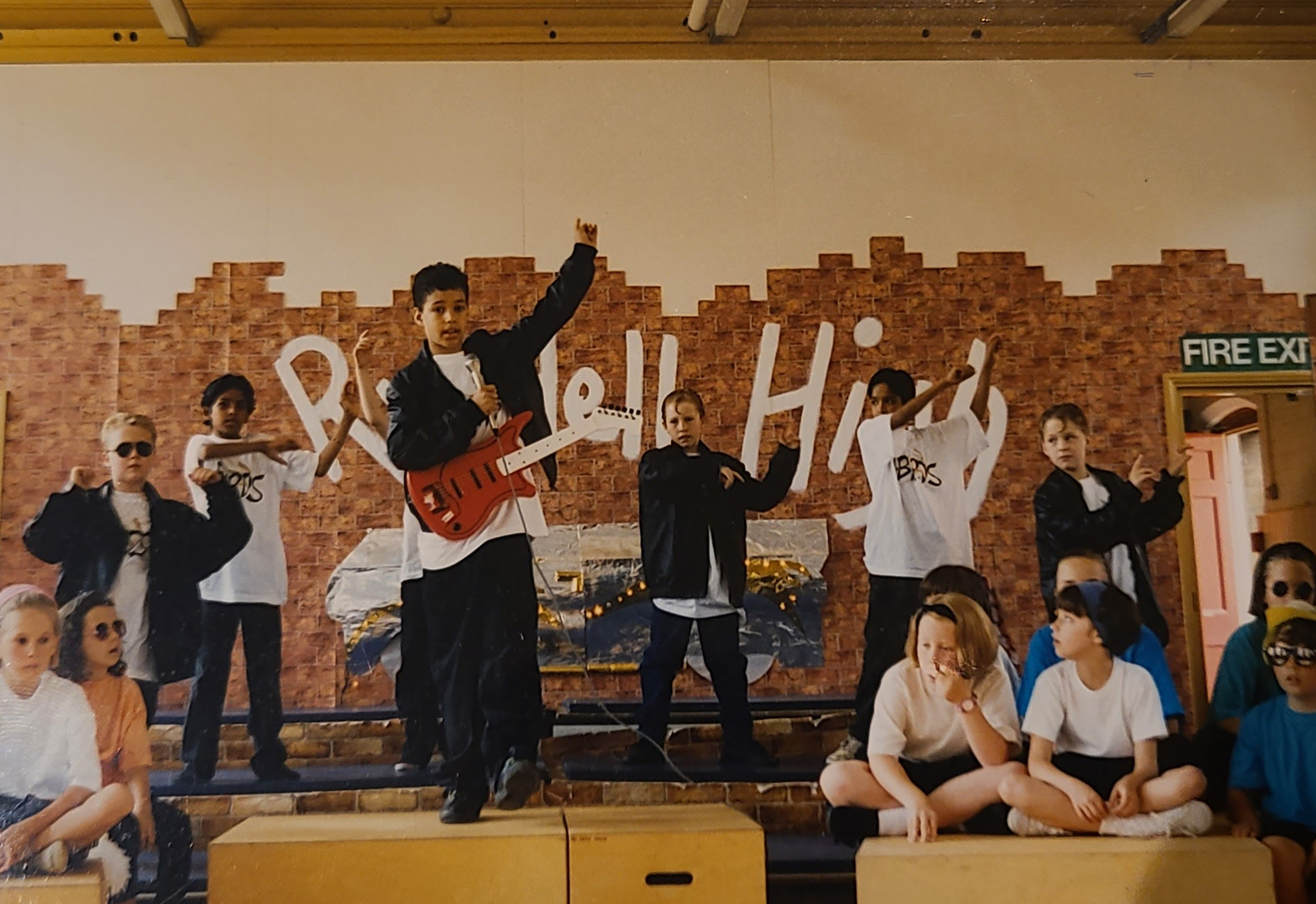 Benjamin Alexander as Kenickie singing Grease Lightning at his primary school's rendition of Grease in 1993 in Wellingborough, England. (Courtesy Benjamin Alexander)