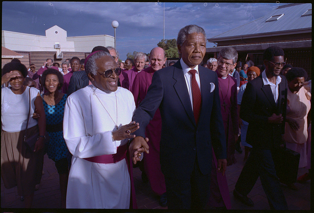 Anti-apartheid campaigners Desmond Tutu (left) and Nelson Mandela, pictured in 1990. (David Turnley–Corbis/VCG/Getty Images)