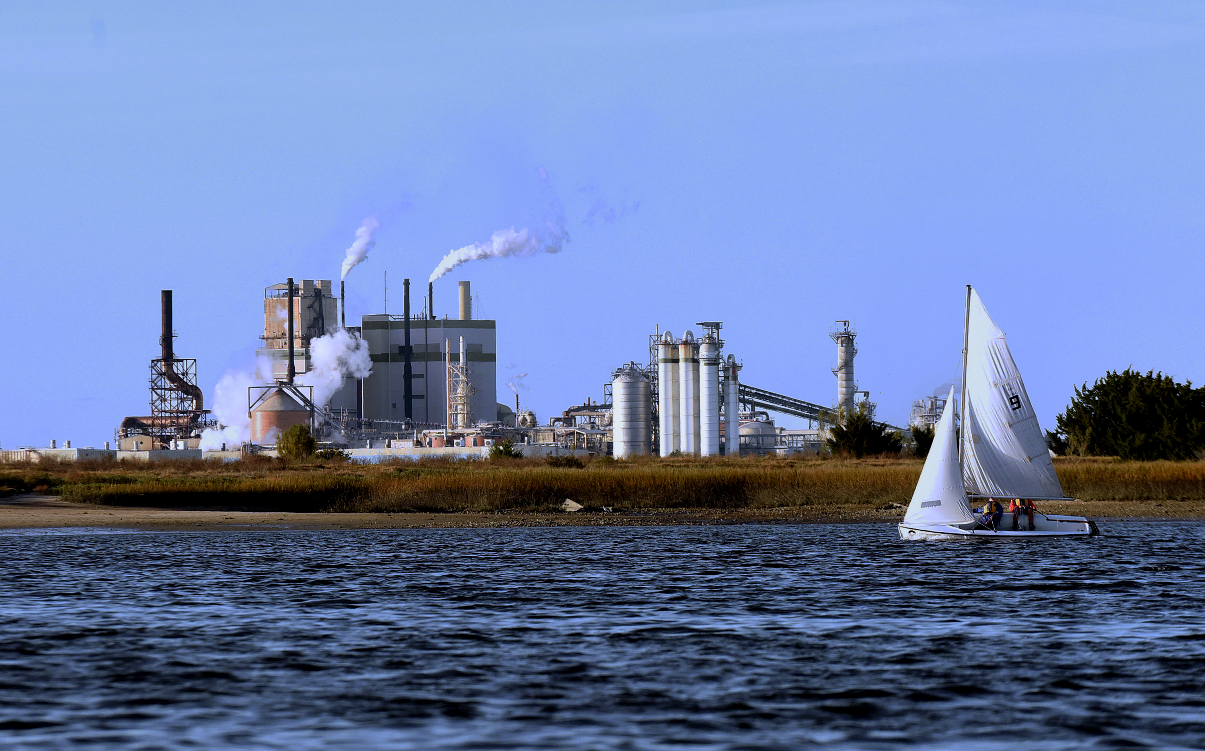 Boaters pass near the Georgia-Pacific pulp and paper mill on Dec. 14, 2020 in Brunswick, Georgia. (Paul Hennessy—NurPhoto/Getty Images)