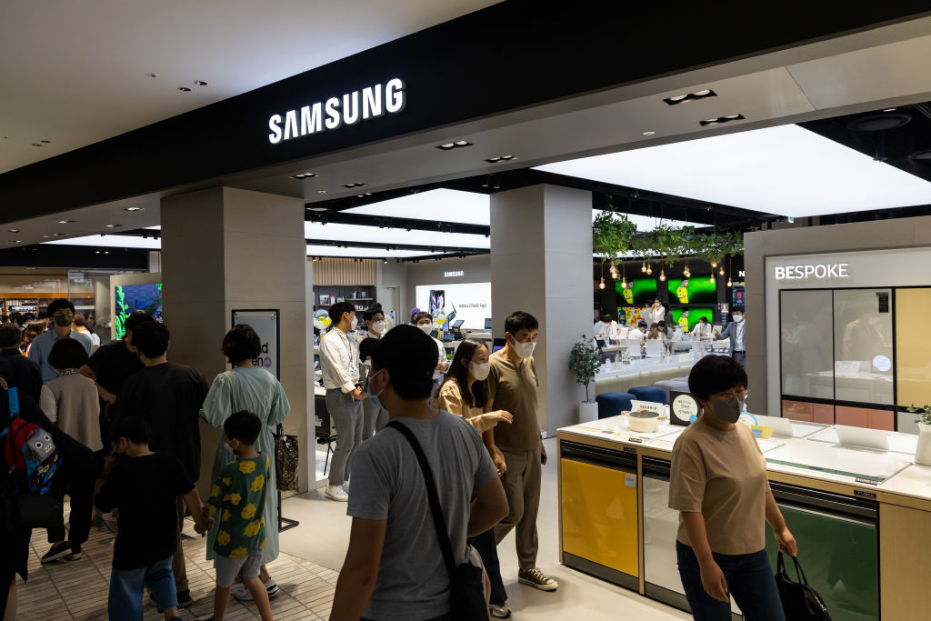 Shoppers walk past the Samsung Electronics Co. Digital Plaza store inside the Hyundai Seoul department store in Seoul, South Korea, on Sunday, Oct. 3, 2021. (SeongJoon Cho/Bloomberg—Getty Images)