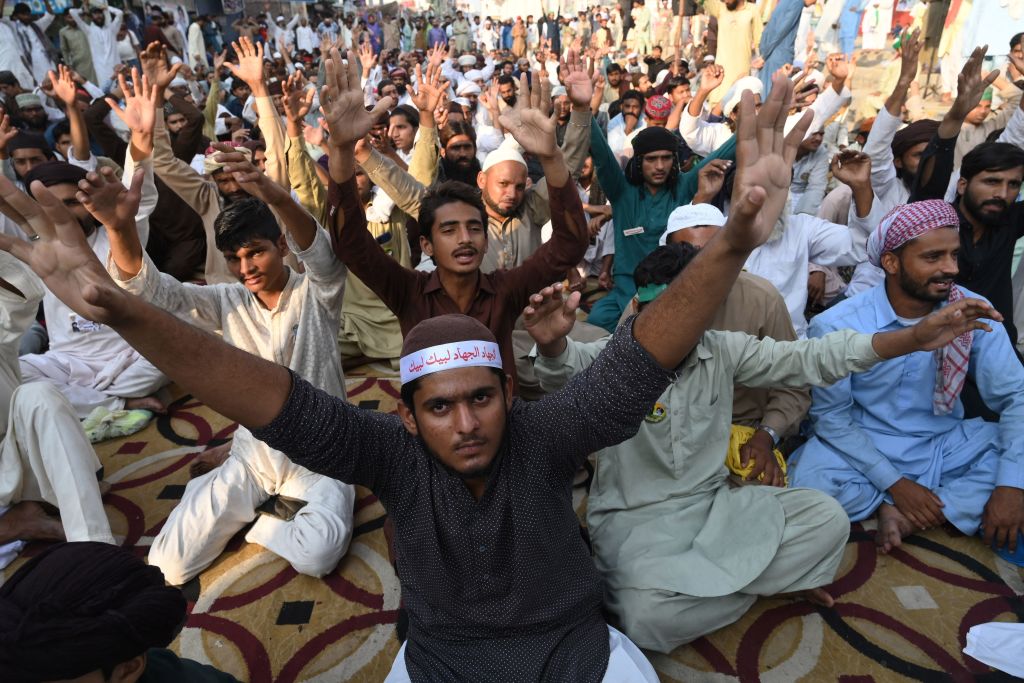 Supporters of the Tehreek-e-Labbaik Pakistan (TLP) party shout slogans during a sit-in protest in Lahore on October 20, 2021 (ARIF ALI/AFP via Getty Images)
