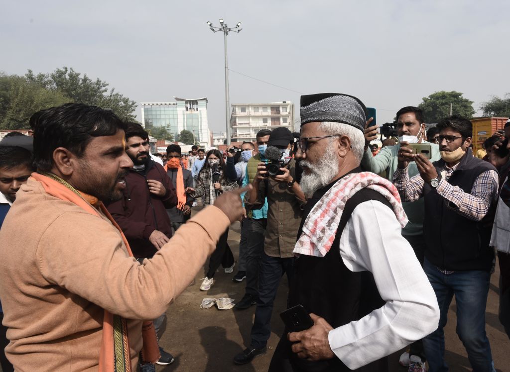 A member of a radical Hindu group confronts a Muslim worshipper on December 3, 2021 in Gurugram, India. (Vipin Kumar/Hindustan Times via Getty Images)